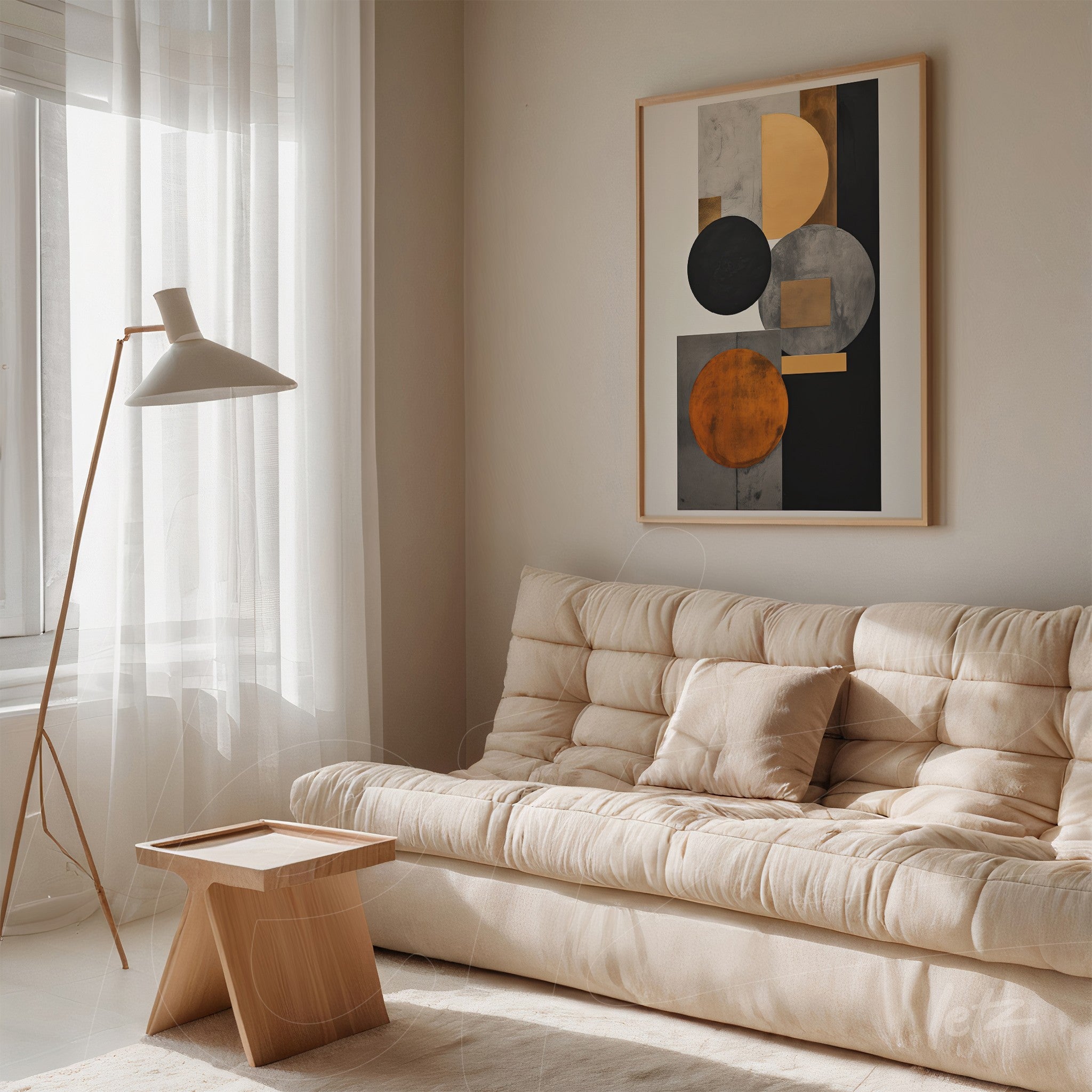 abstract wall art in light frame featuring circular shapes in shades of gray and orange on neutral wall