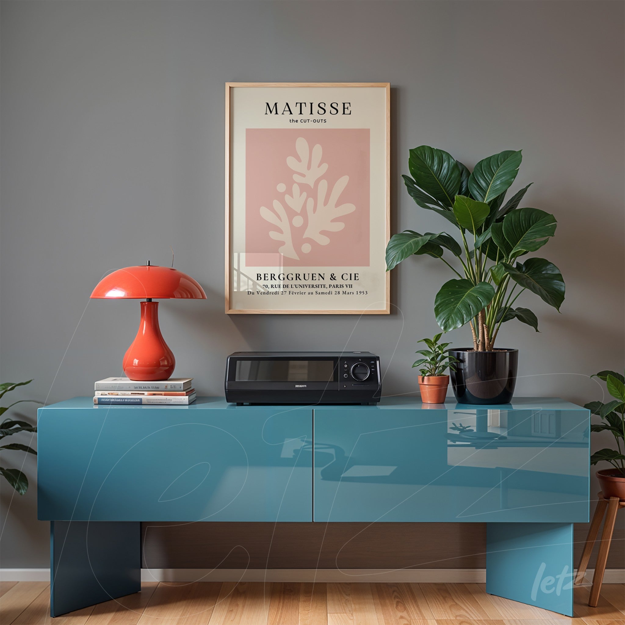framed modern art print of a plant in pastel colors displayed on a glossy blue console in a minimalist living room