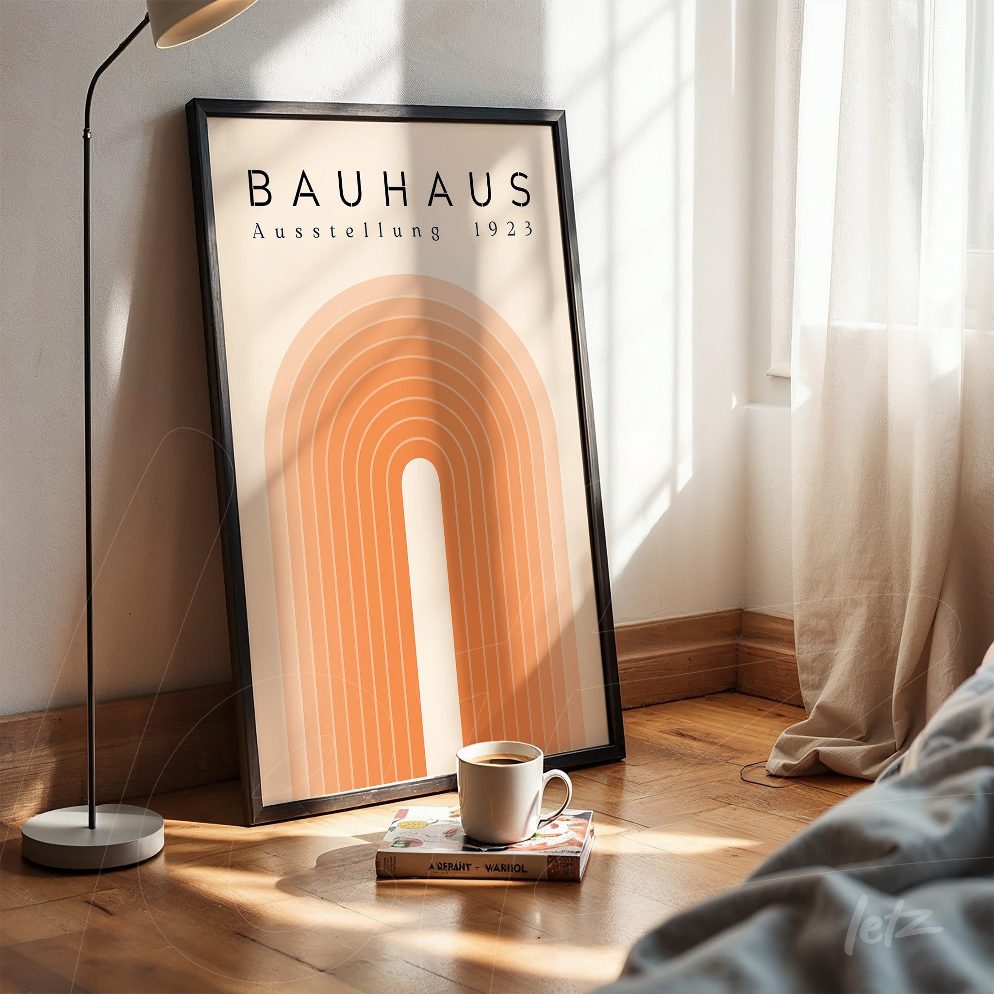 poster featuring geometric design from the Bauhaus movement in black frame on wooden floor