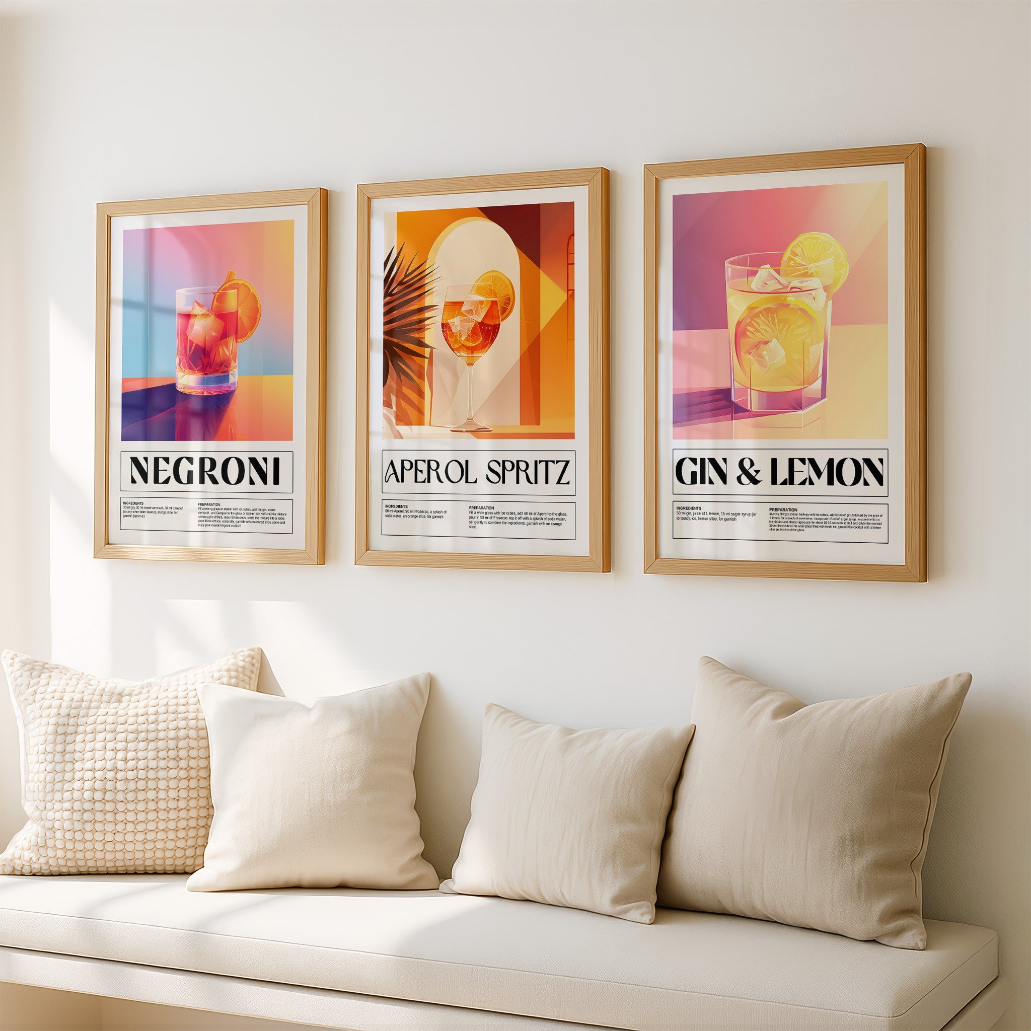 series of framed artwork featuring colorful drink illustrations with gold frames against a light wall