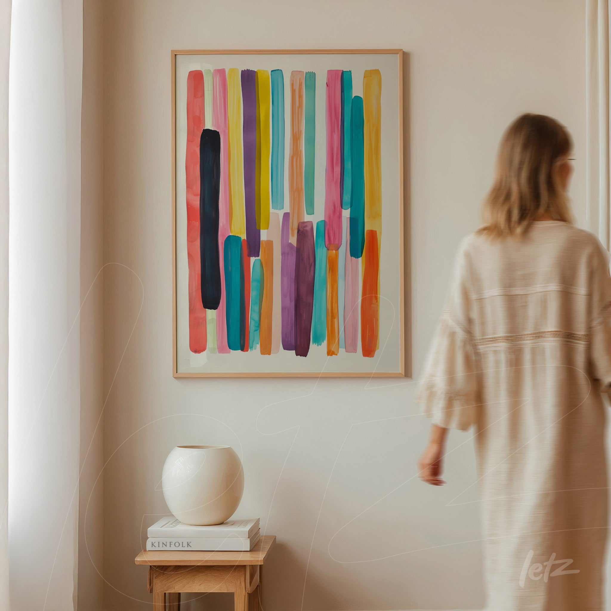 framed wall art featuring colorful abstract stripes in vibrant tones against a neutral wall