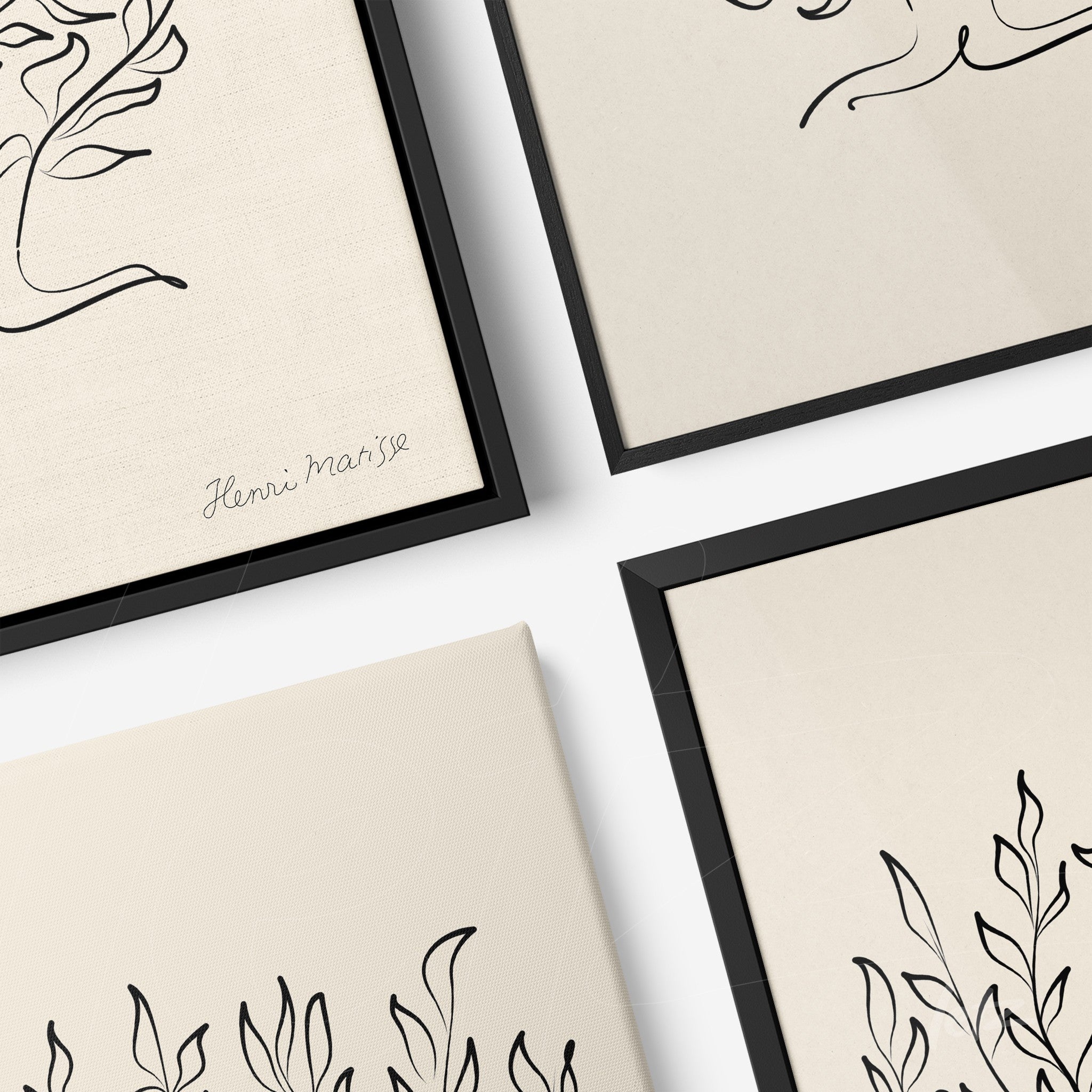 collection of framed minimalistic leaf art in black frames set against a light background