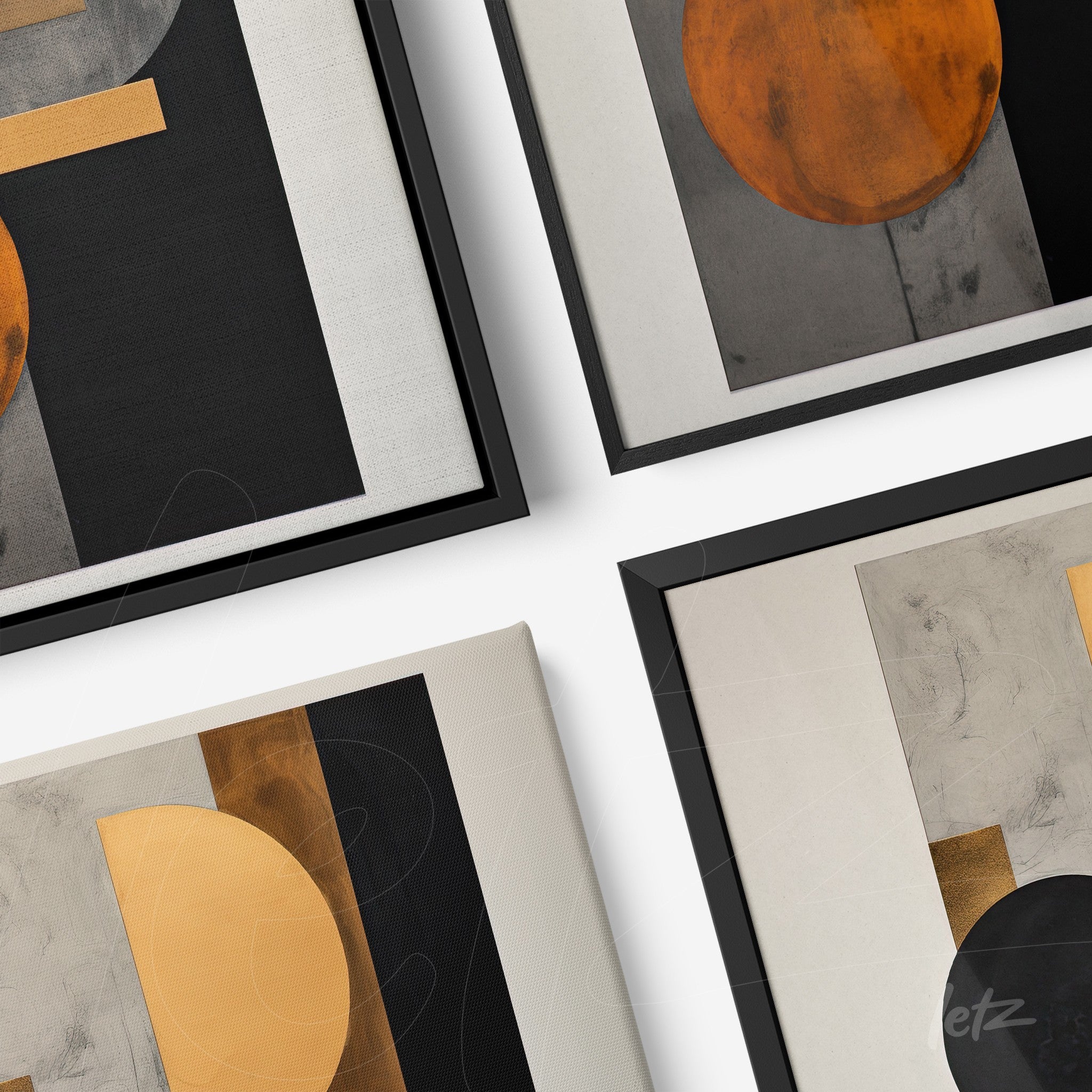 collection of abstract wall art in black, gray, and orange tones with sleek black frames