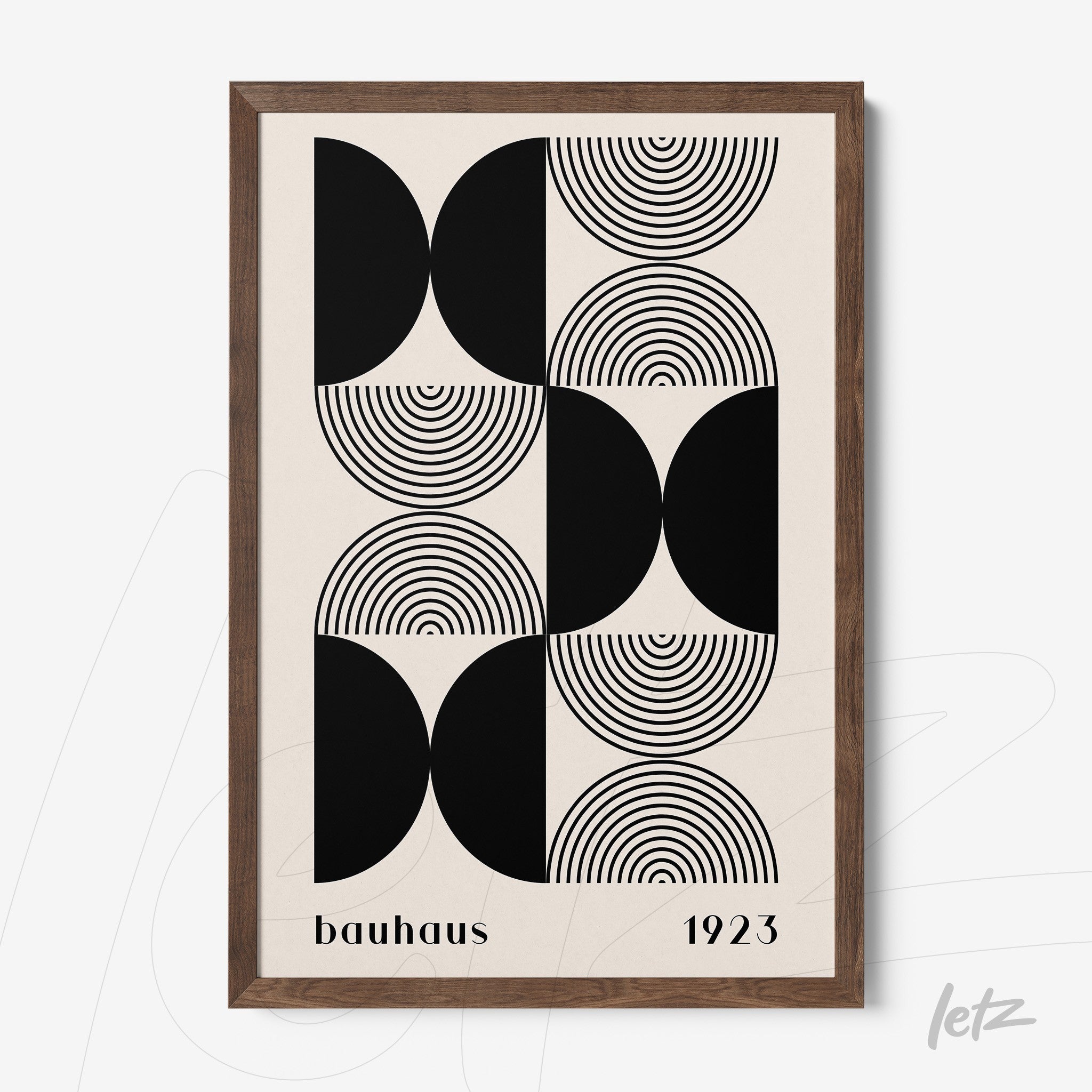 canvas art with black and white geometric Bauhaus style design in dark wood frame