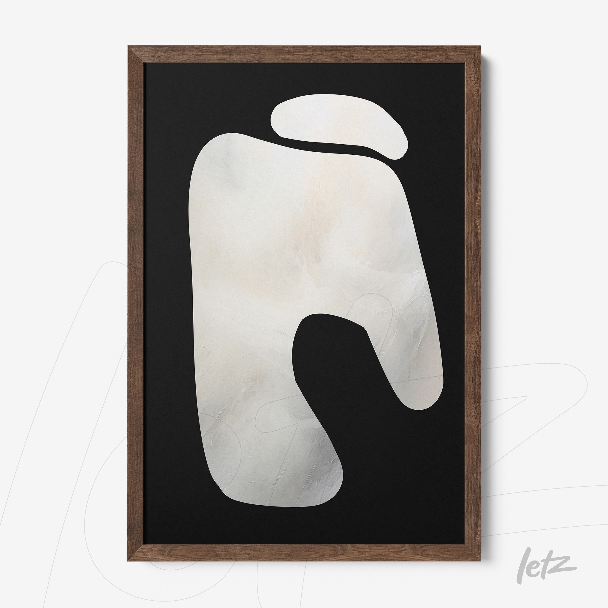 abstract wall art in neutral tones on black background in dark wood frame
