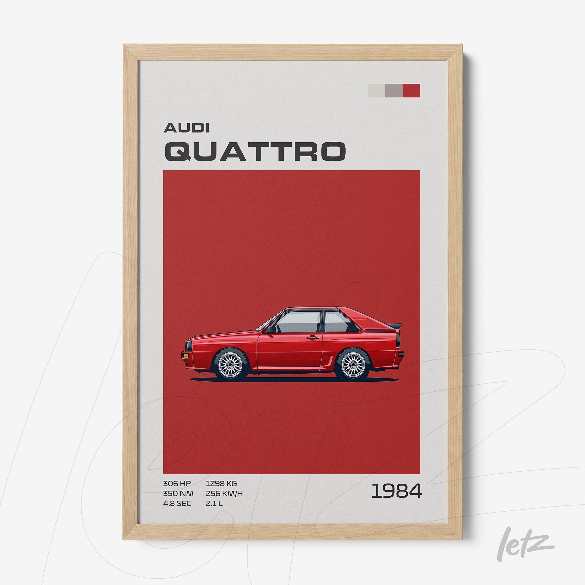 framed artwork featuring a red Audi Quattro car illustration on a red background with light wood frame and graphic text elements