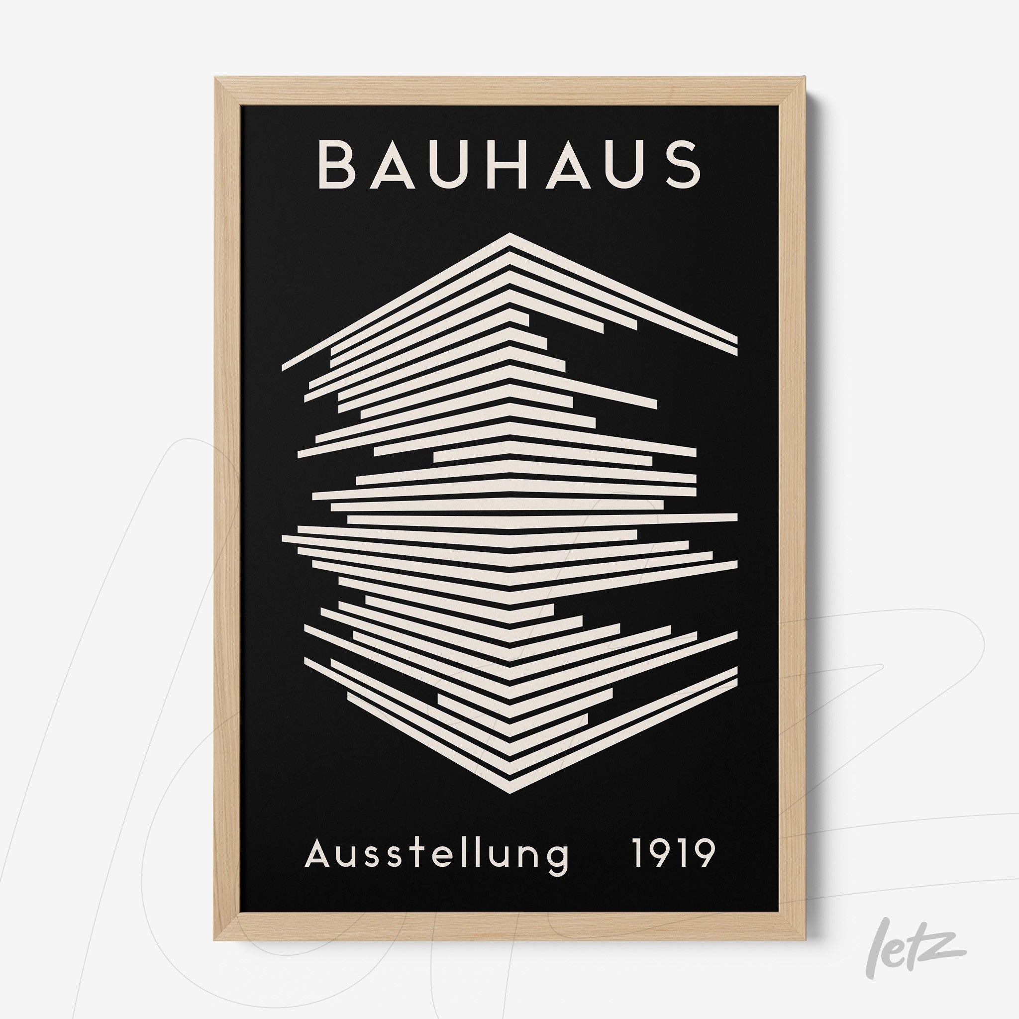 poster with bauhaus-inspired geometric art in light wood frame