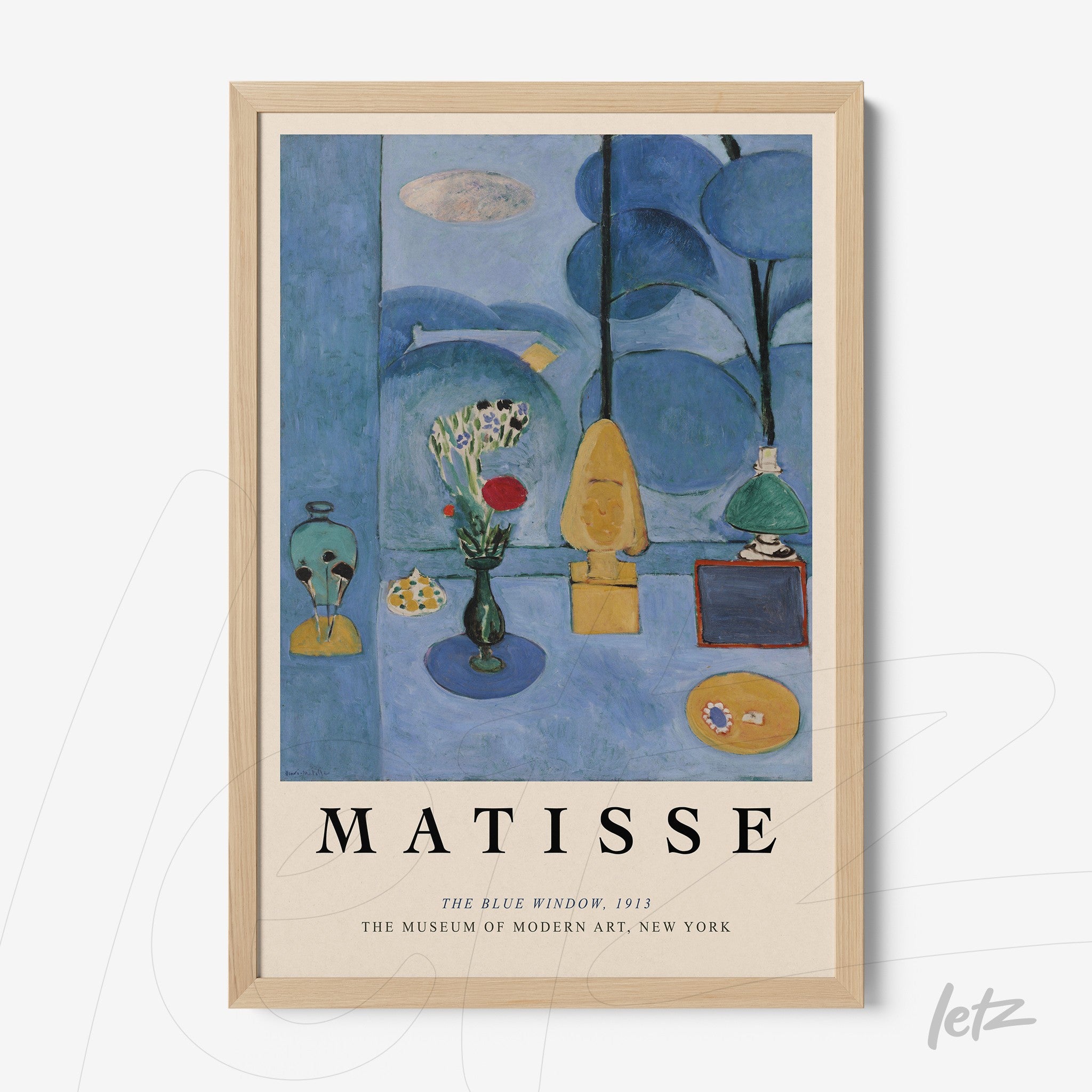framed artwork by Henri Matisse titled 'The Blue Window' with light wood frame