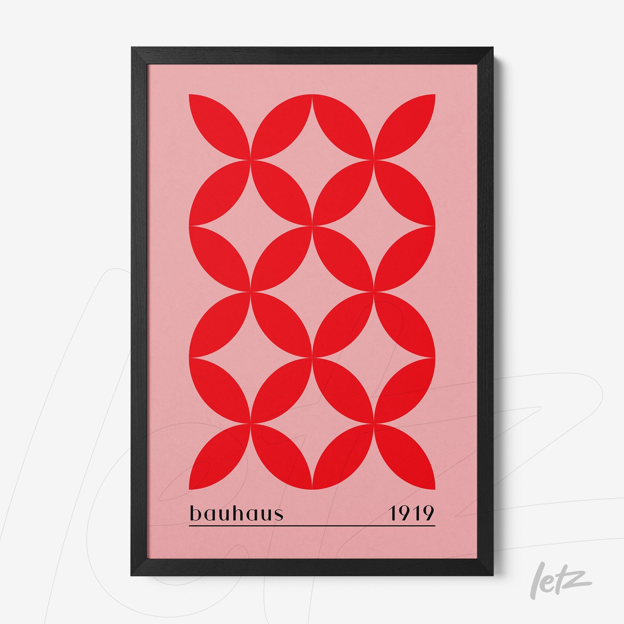 poster of red geometric art on pink background with thin black frame