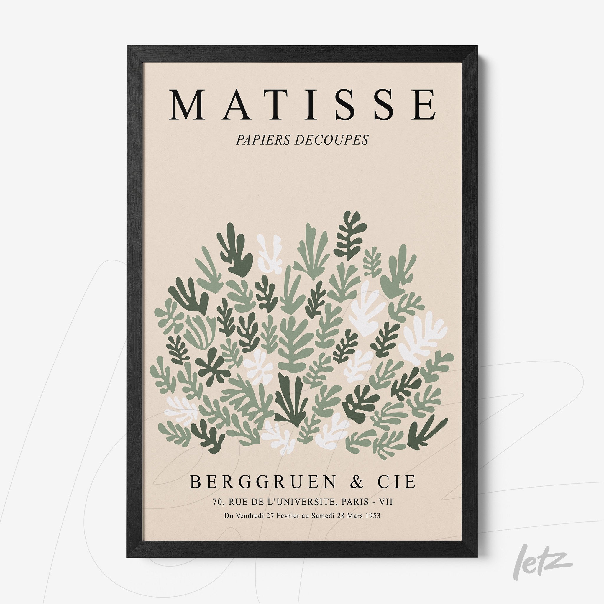 framed art print of stylized leaves in shades of green and white with a thin black frame