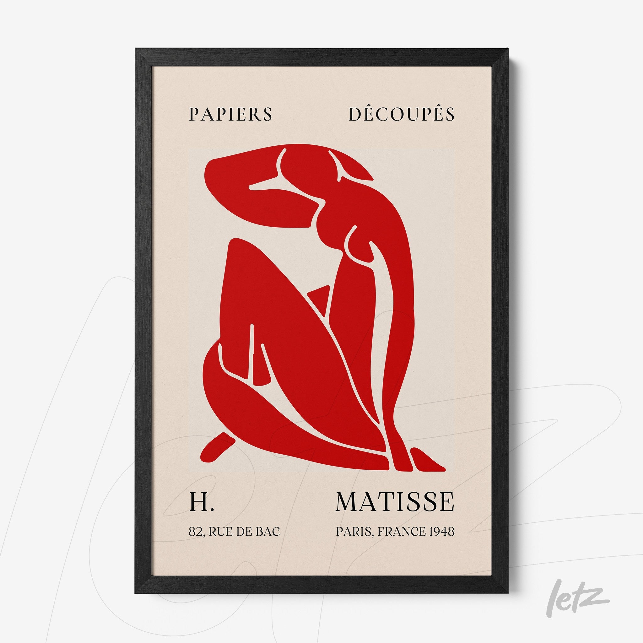 framed modern art piece featuring a red female silhouette with black frame