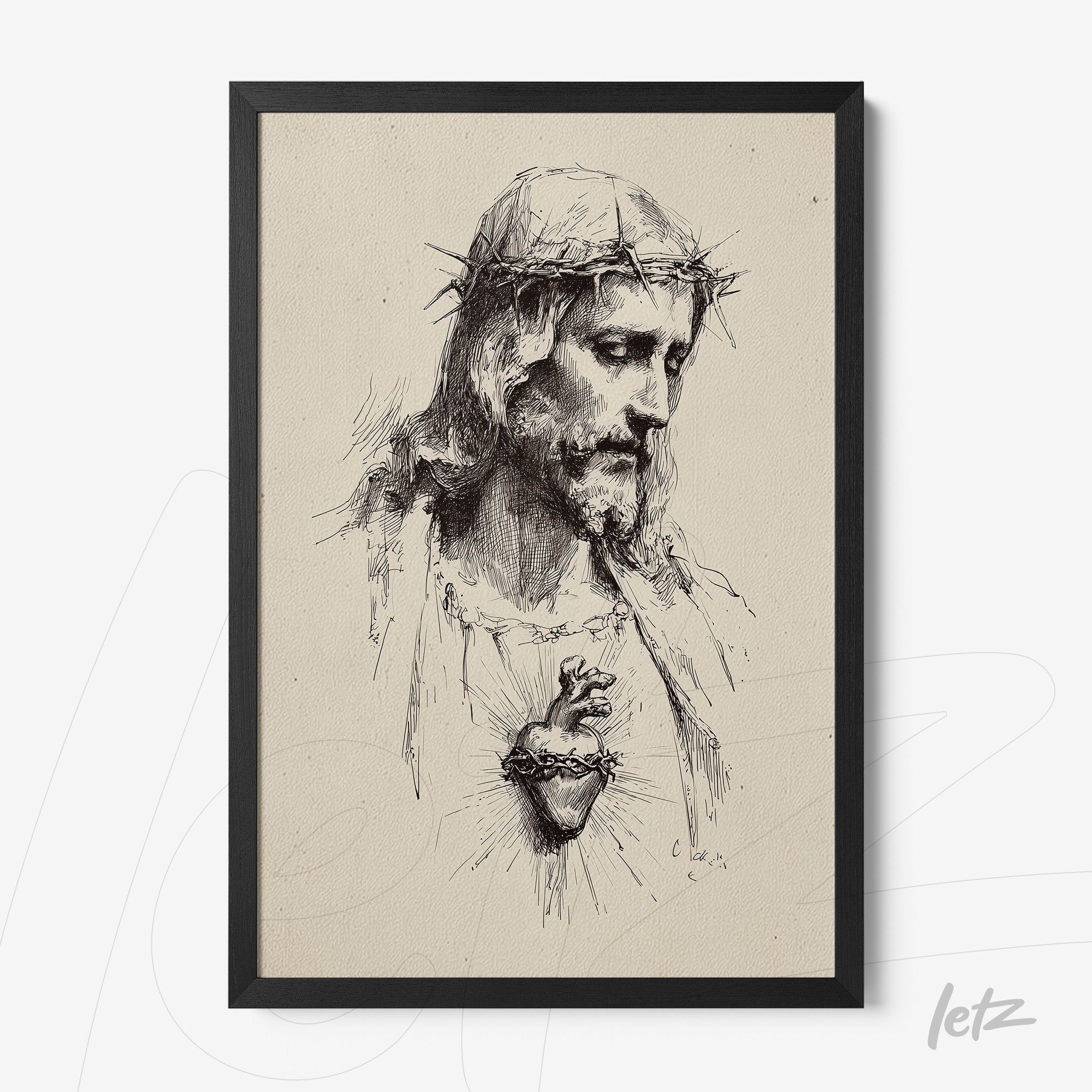 framed wall art featuring a black and white illustration of Jesus Christ with a crown of thorns and exposed heart in black frame