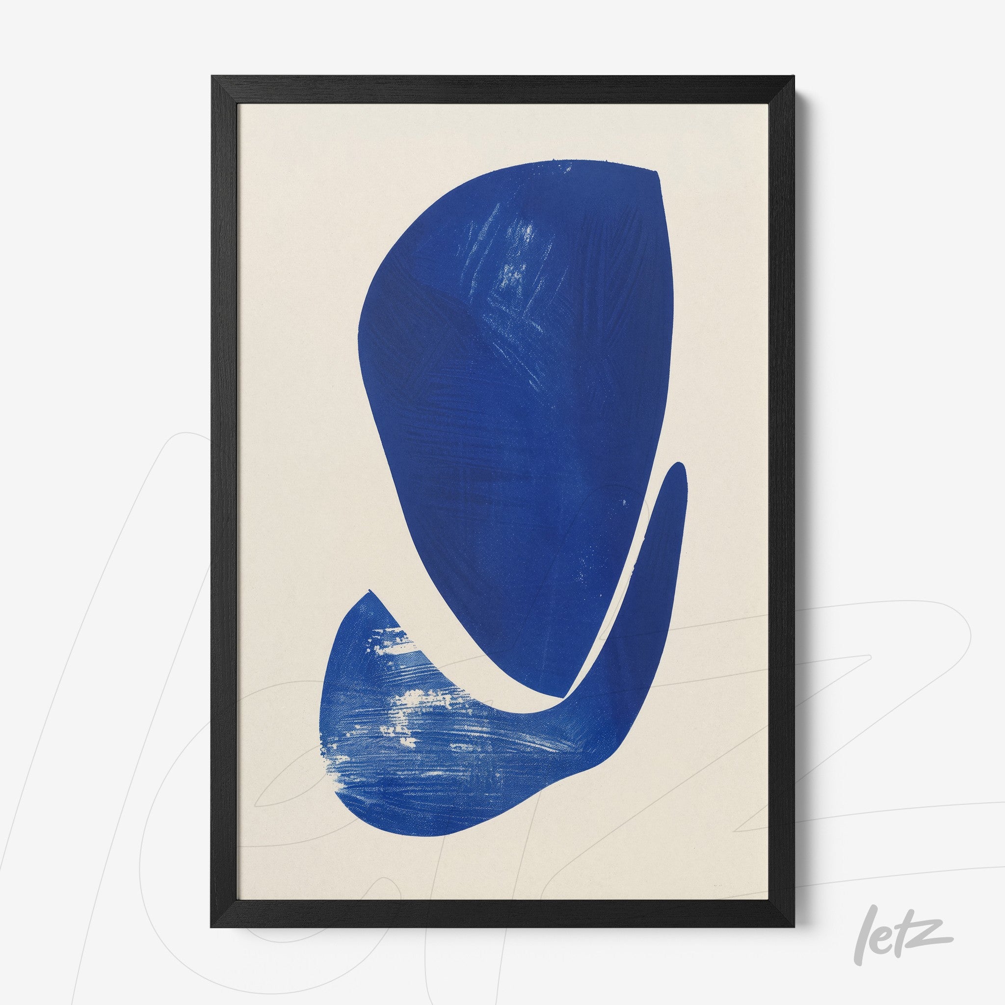 framed abstract artwork in blue with black frame