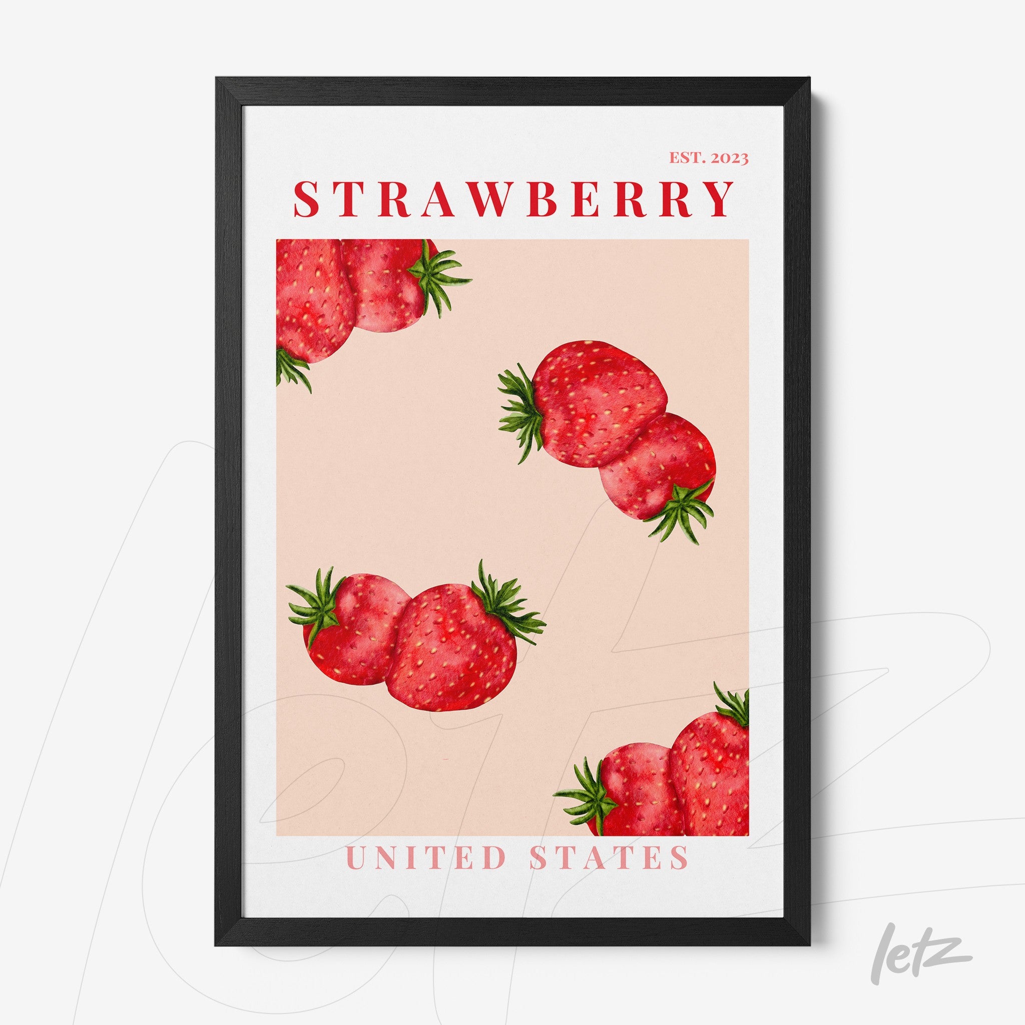 framed art featuring strawberries on a pink background with a black frame