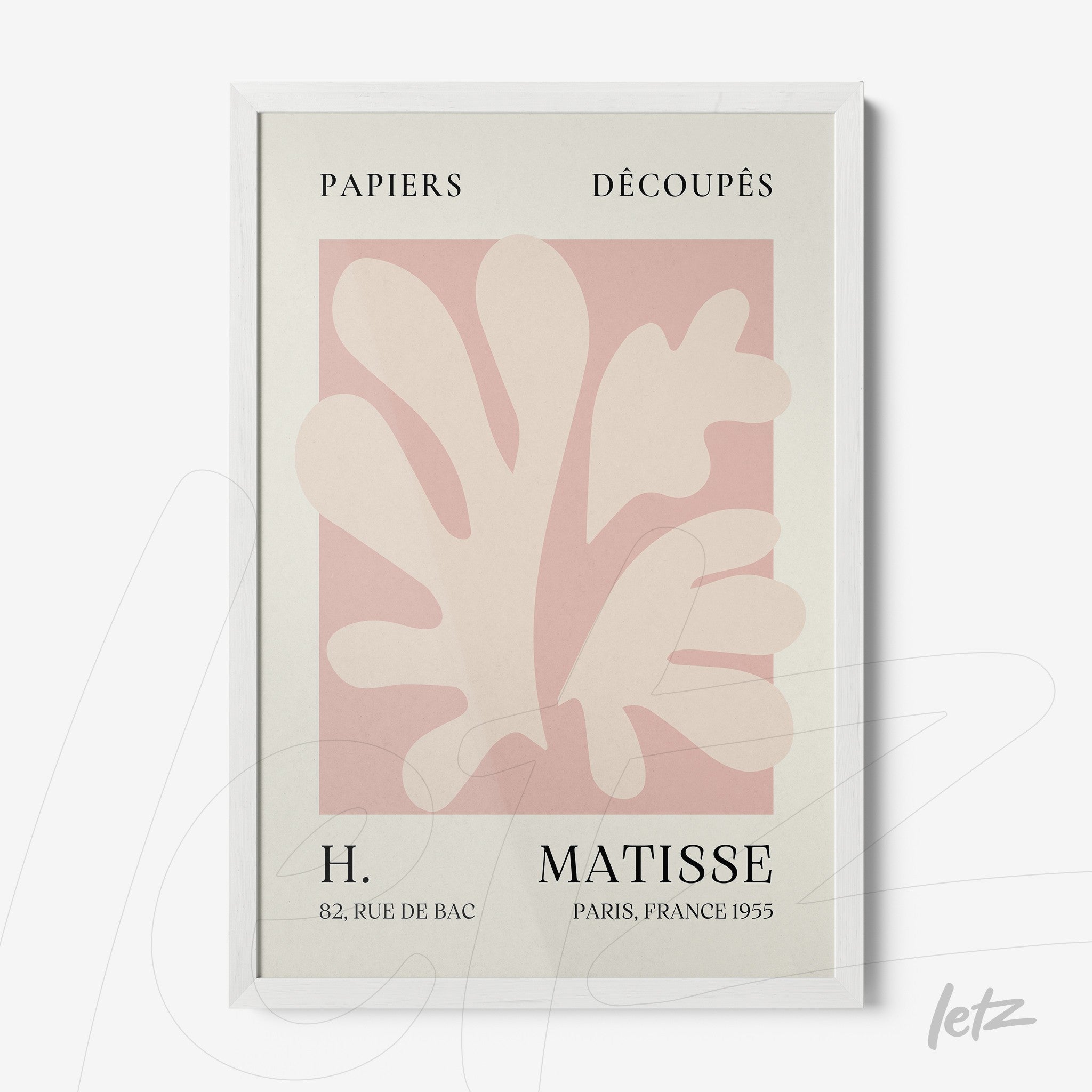 framed wall art featuring light-toned paper cutouts on soft pink background