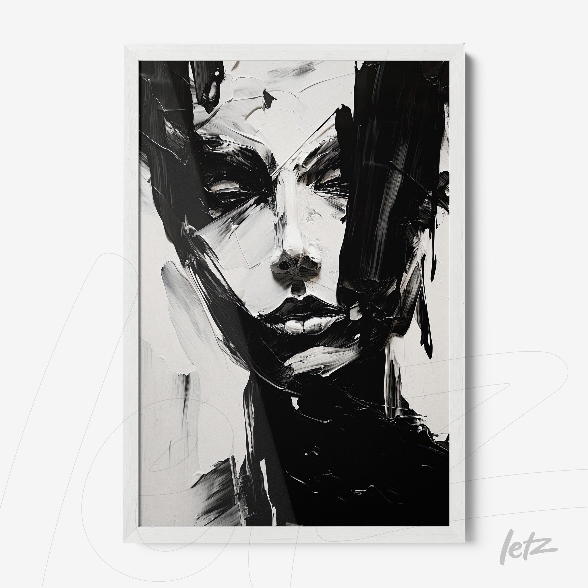 framed abstract artwork in black and white depicting a female face with white frame