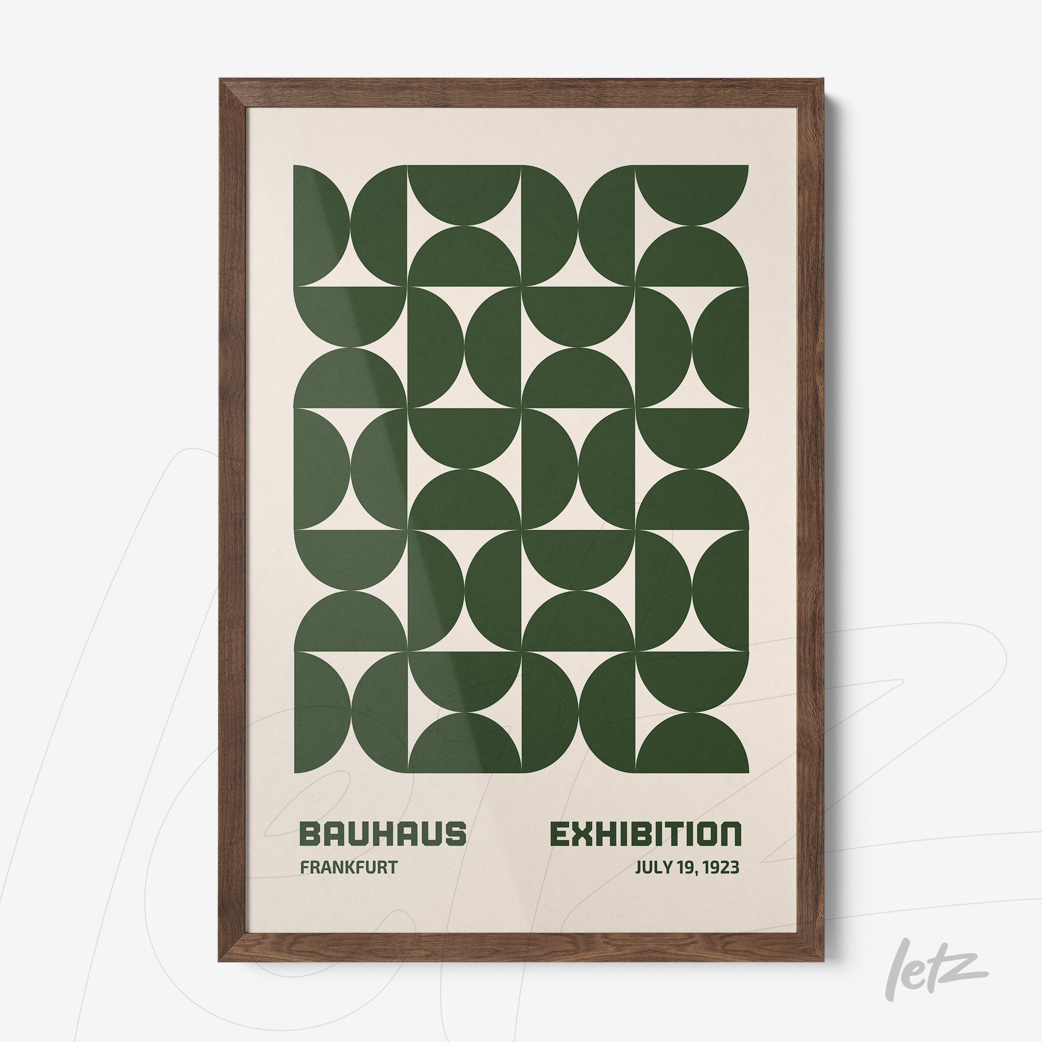 poster featuring green geometric bauhaus style design in dark wood frame