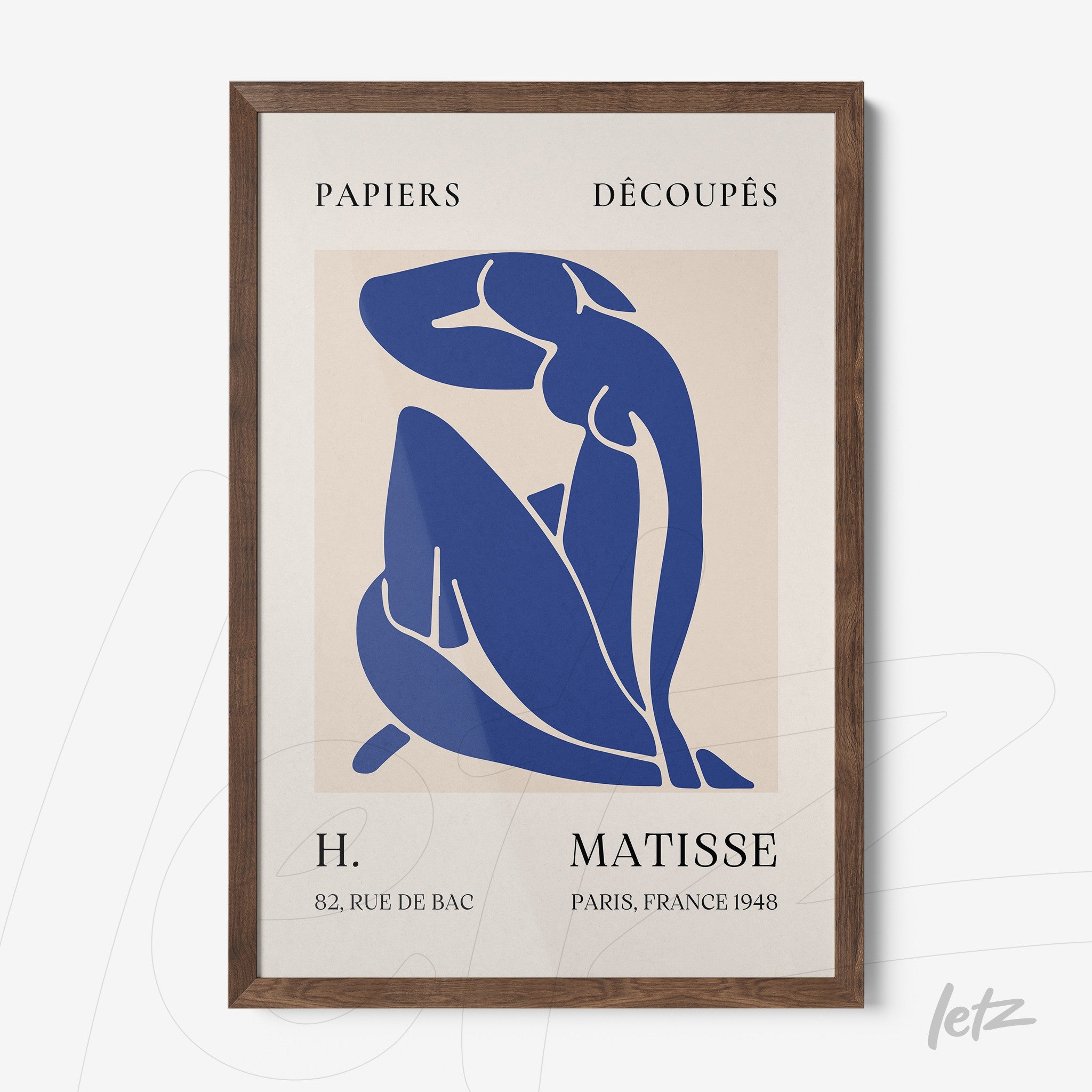 framed modern art print featuring blue shapes against a light background with dark wood frame inspired by Matisse