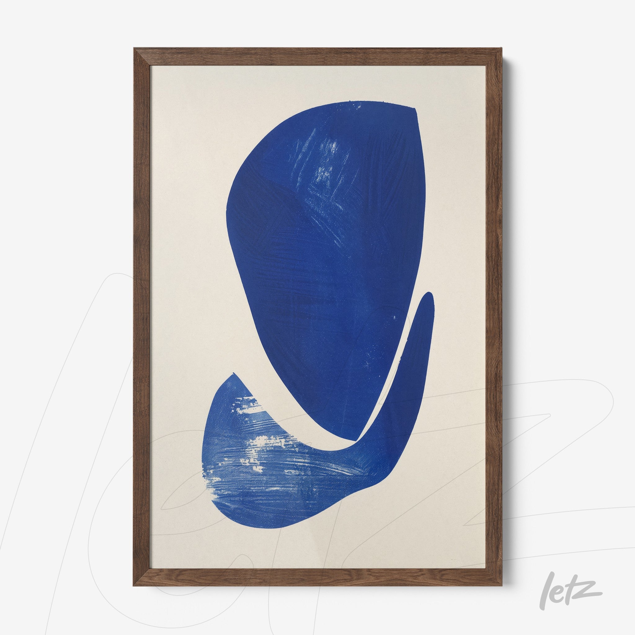 abstract wall art in blue tones framed in dark wood