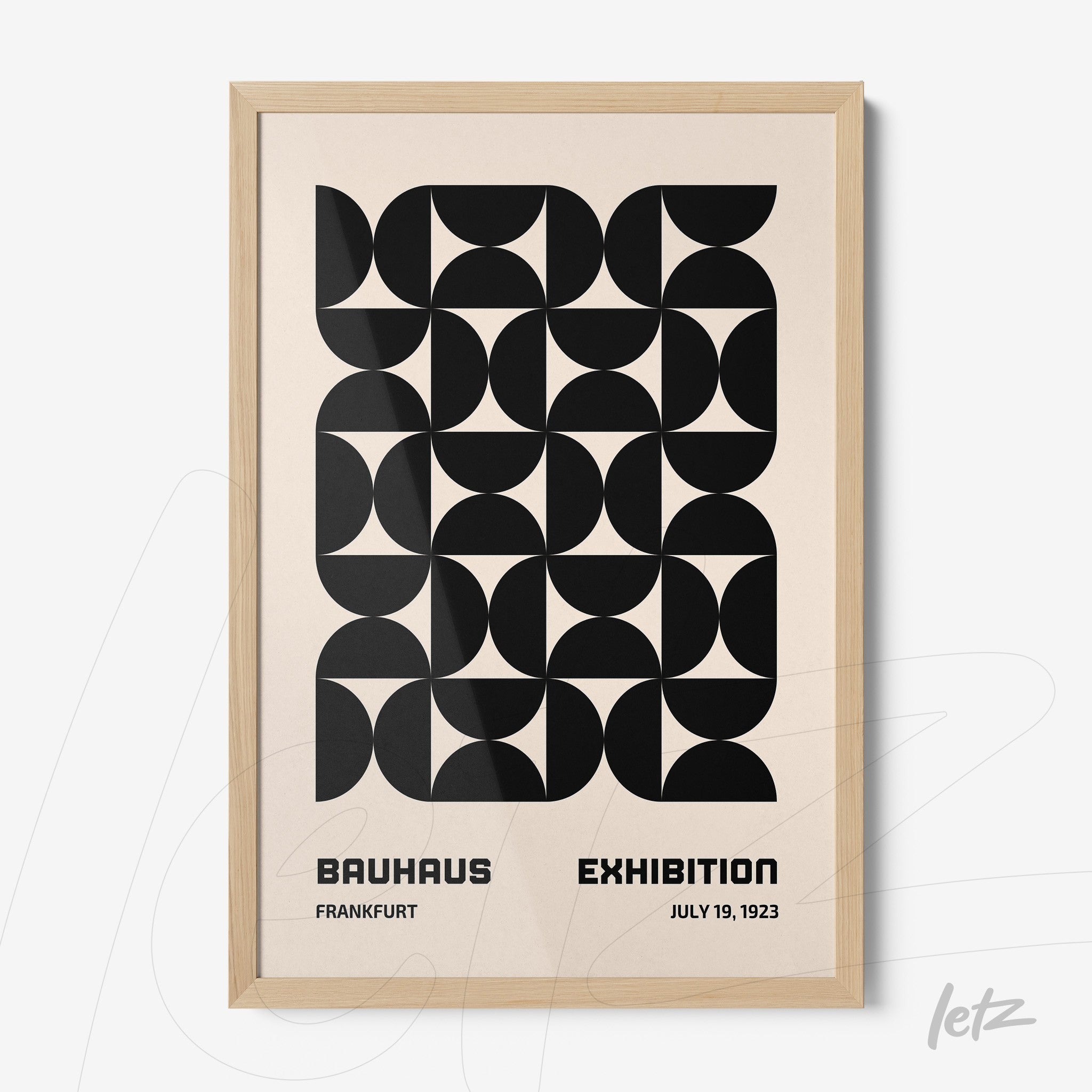 poster featuring abstract geometric black and white design, framed in light wood