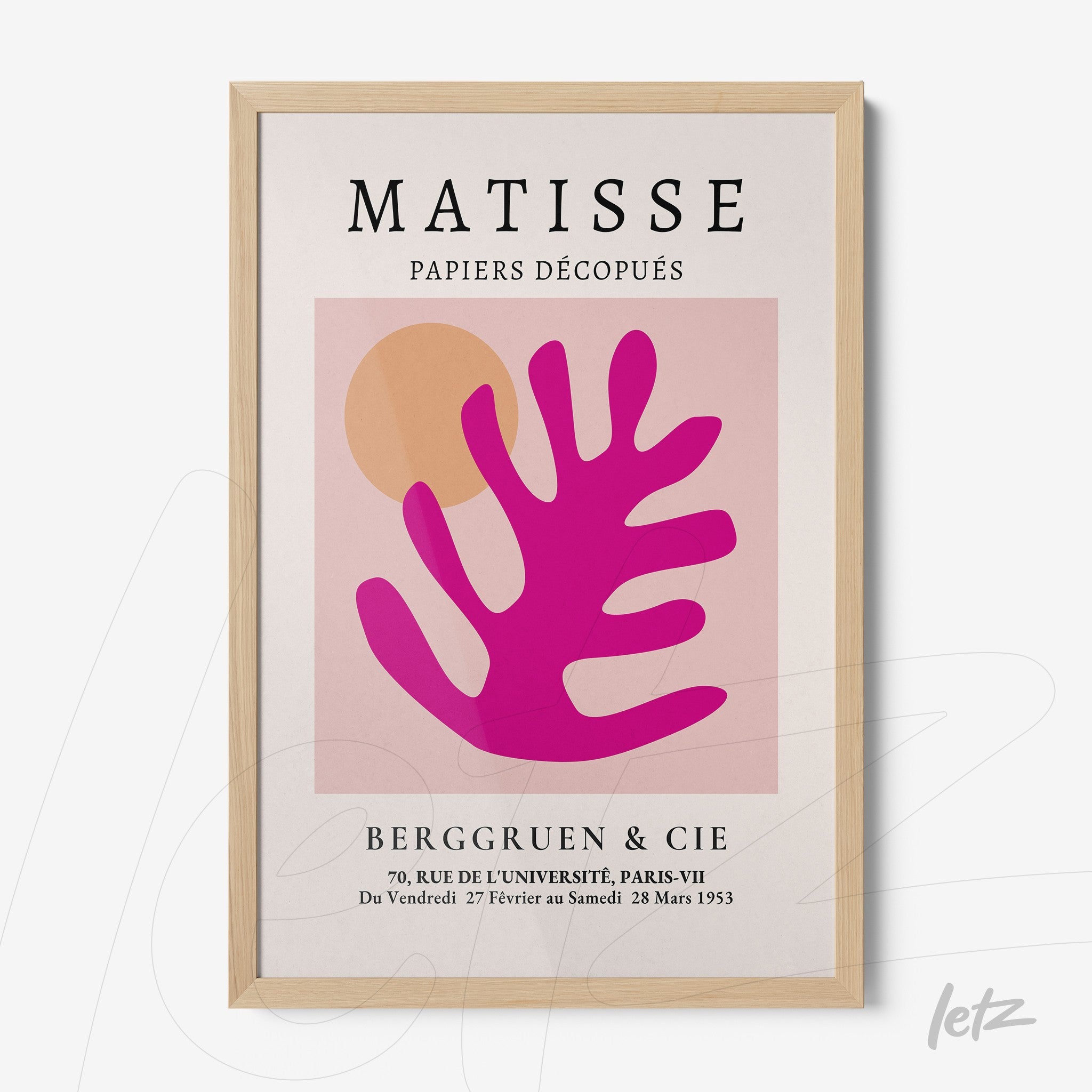 framed wall art featuring abstract leaves in shades of pink and orange on a light background with a light wood frame