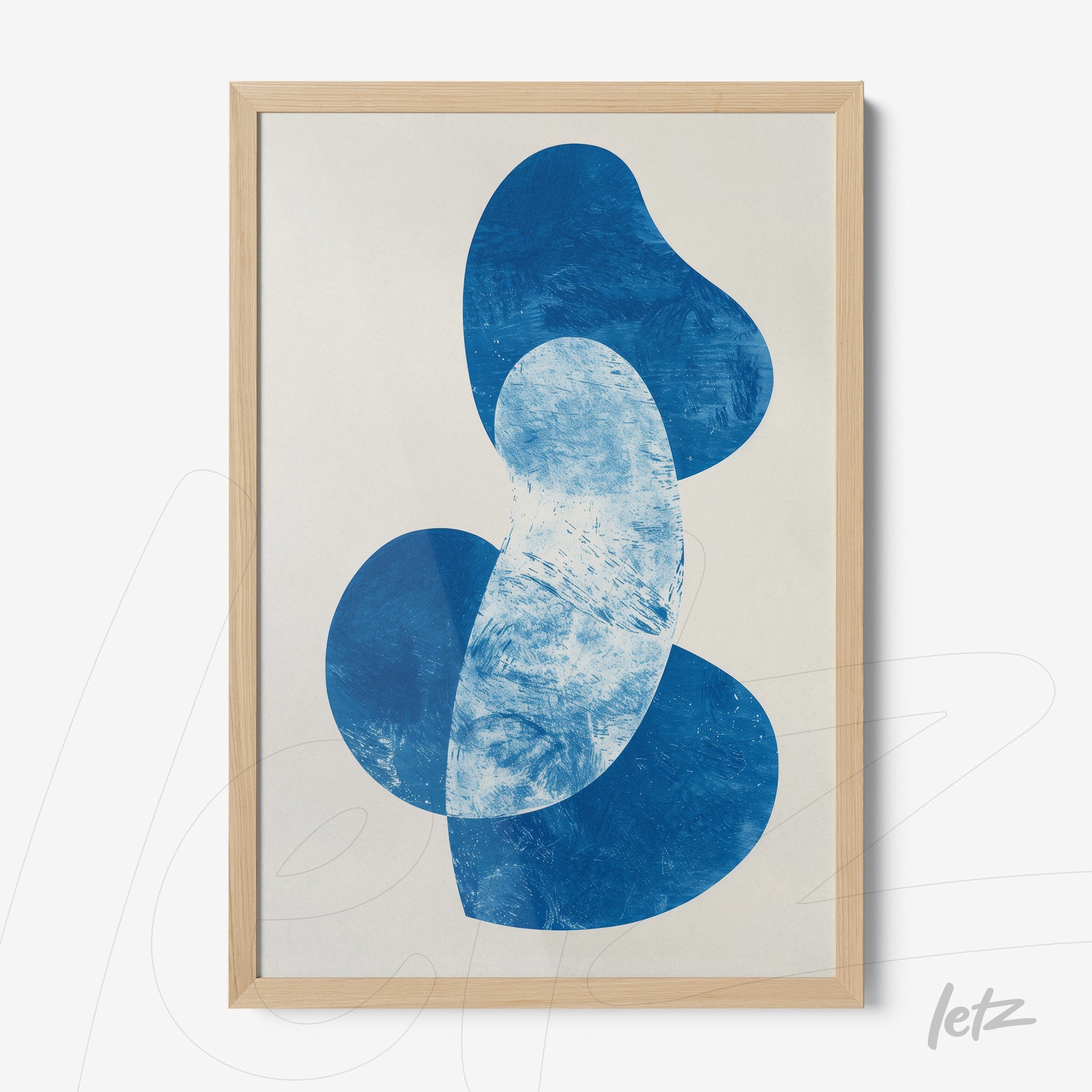 abstract wall art in shades of blue with light wood frame