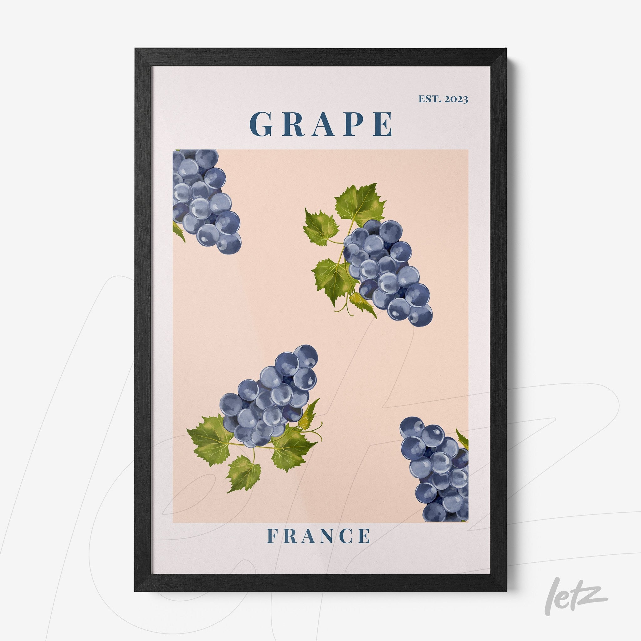 framed wall art featuring blue grapes on a light pink background with black frame