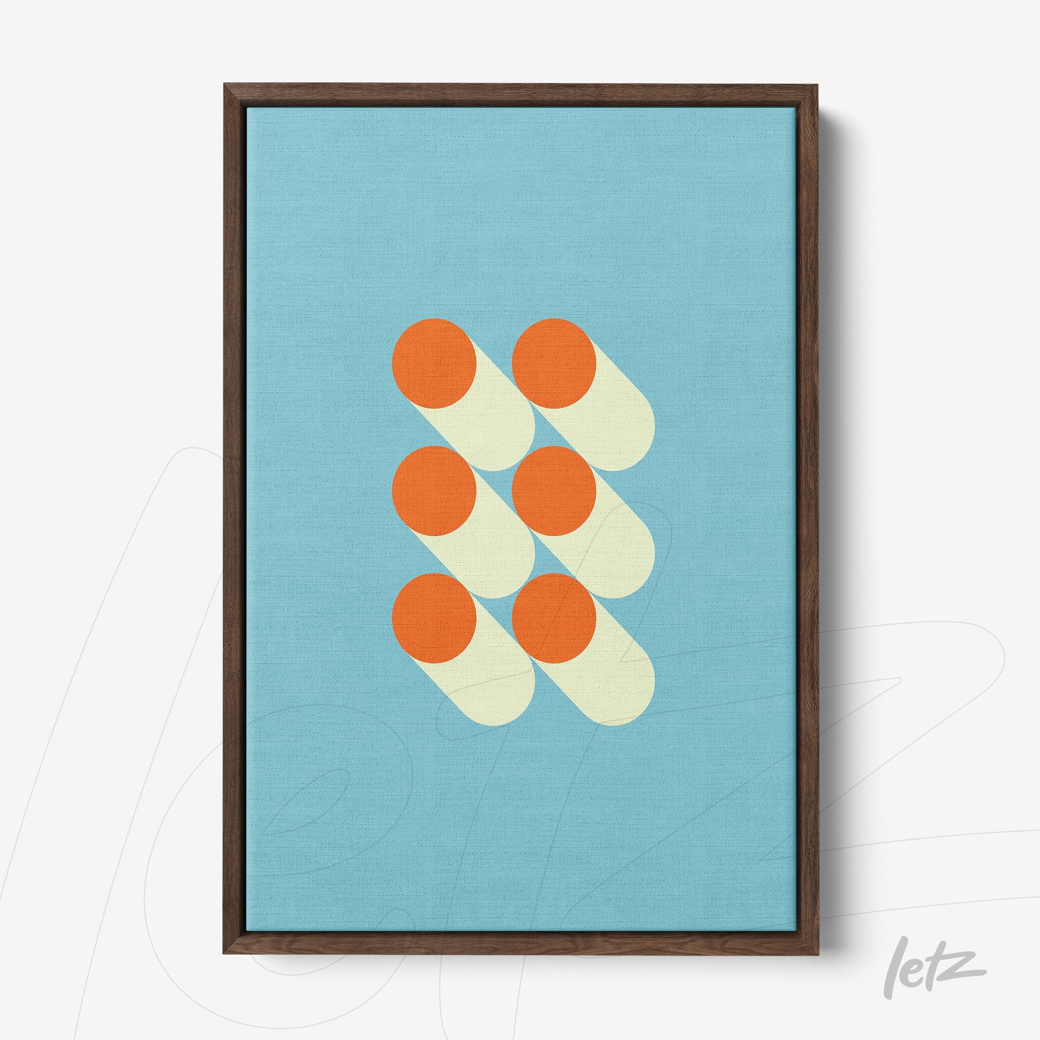 canvas print featuring abstract geometric art with orange circles and shadows on light blue background framed in dark wood