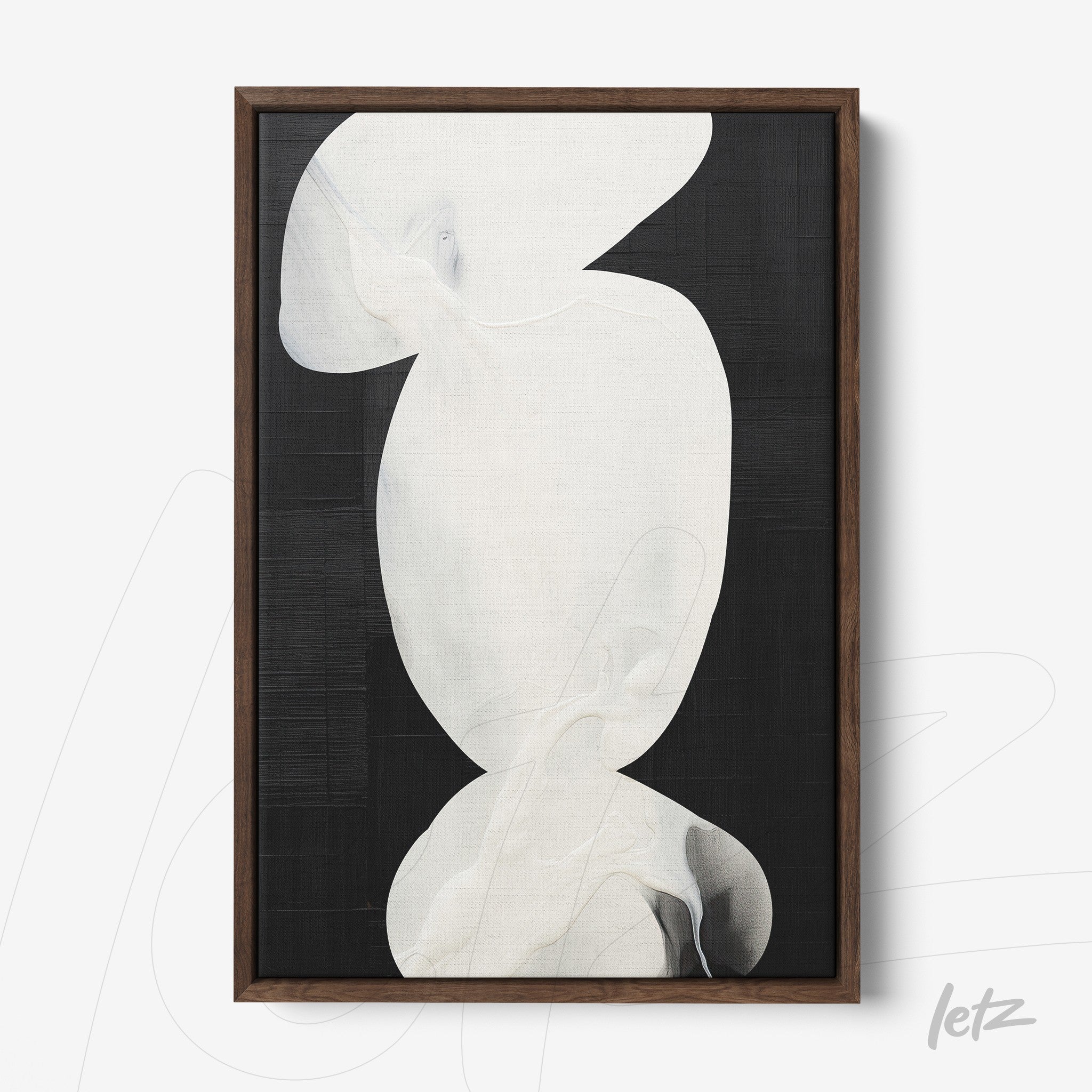 abstract wall art in white tones on black background, framed with dark wood