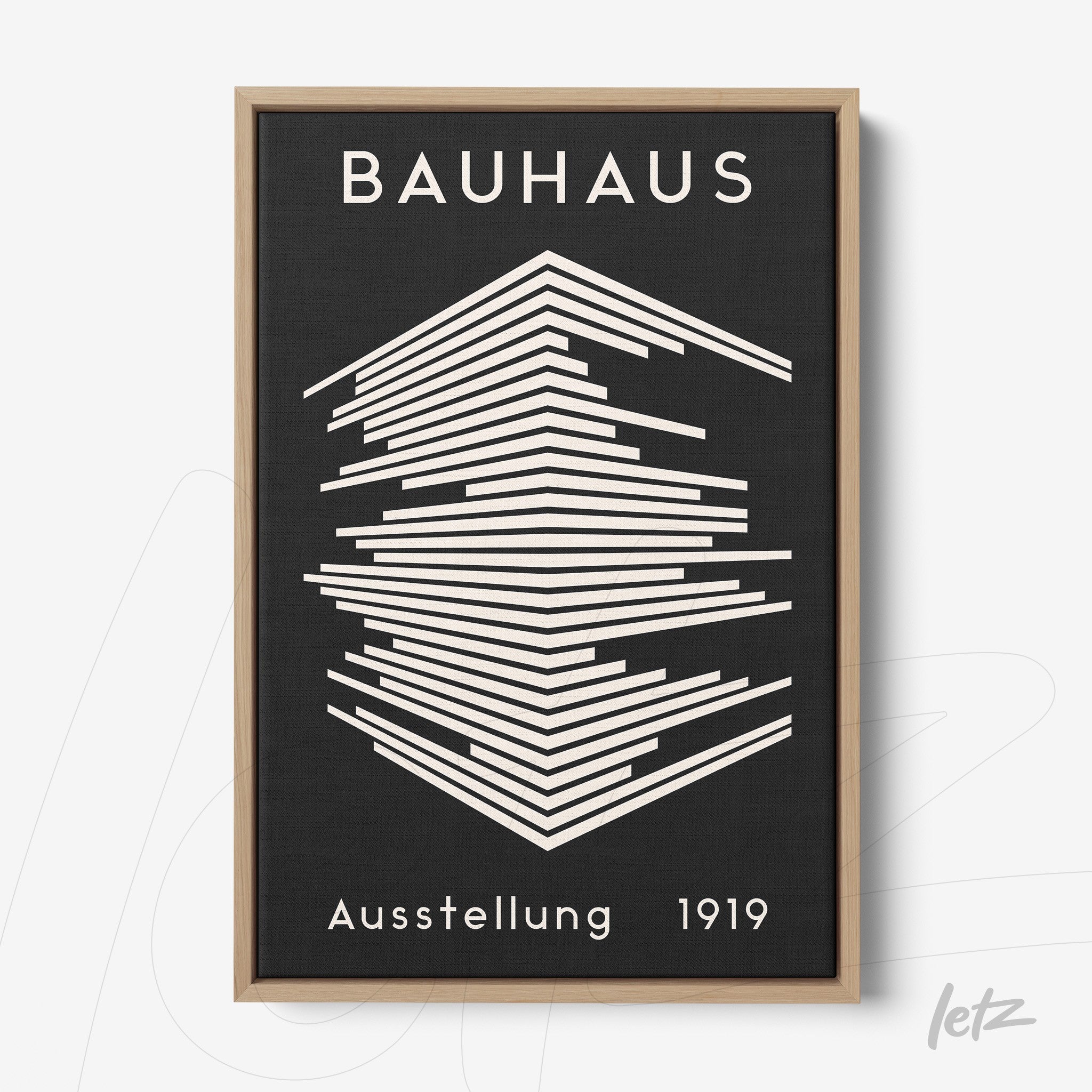bauhaus style framed artwork featuring white geometric lines on a black background with light wood frame