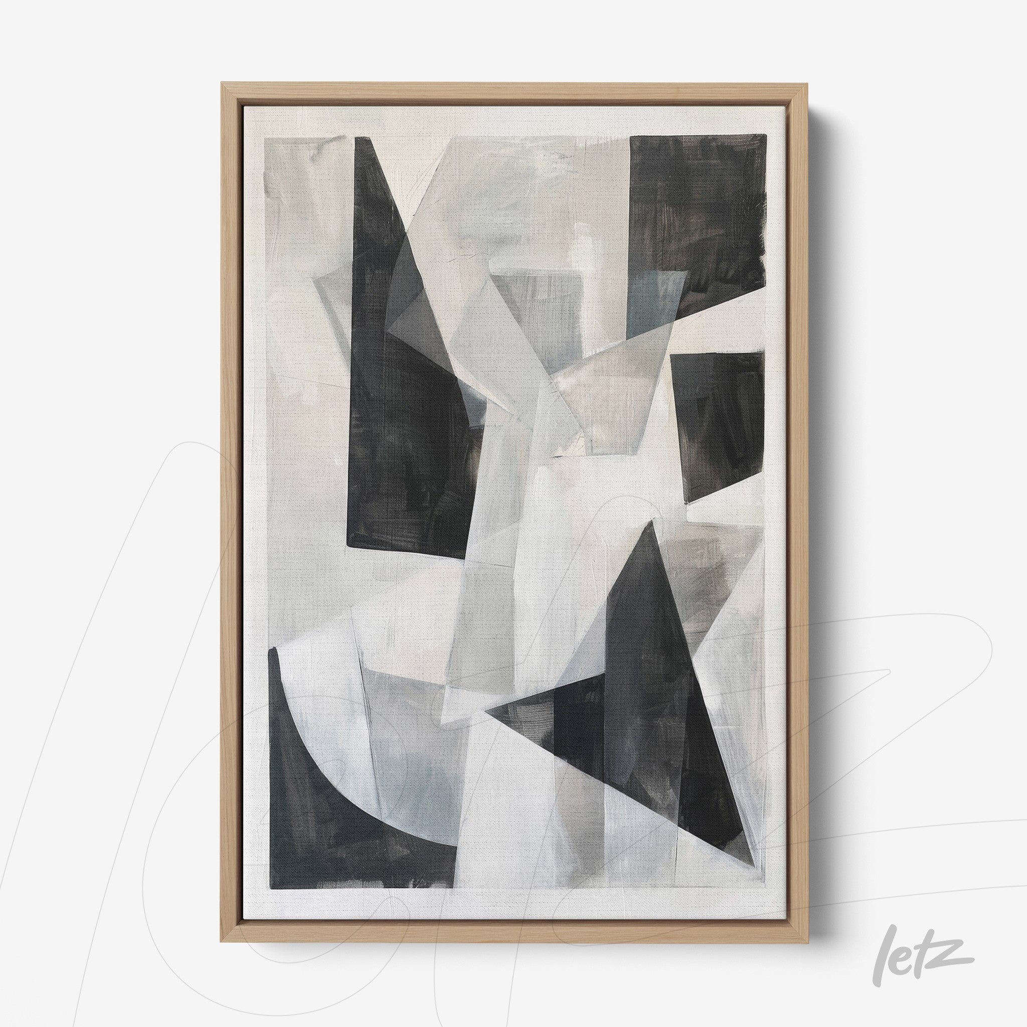 abstract wall art featuring gray and black geometric shapes on a light background with a light wood frame