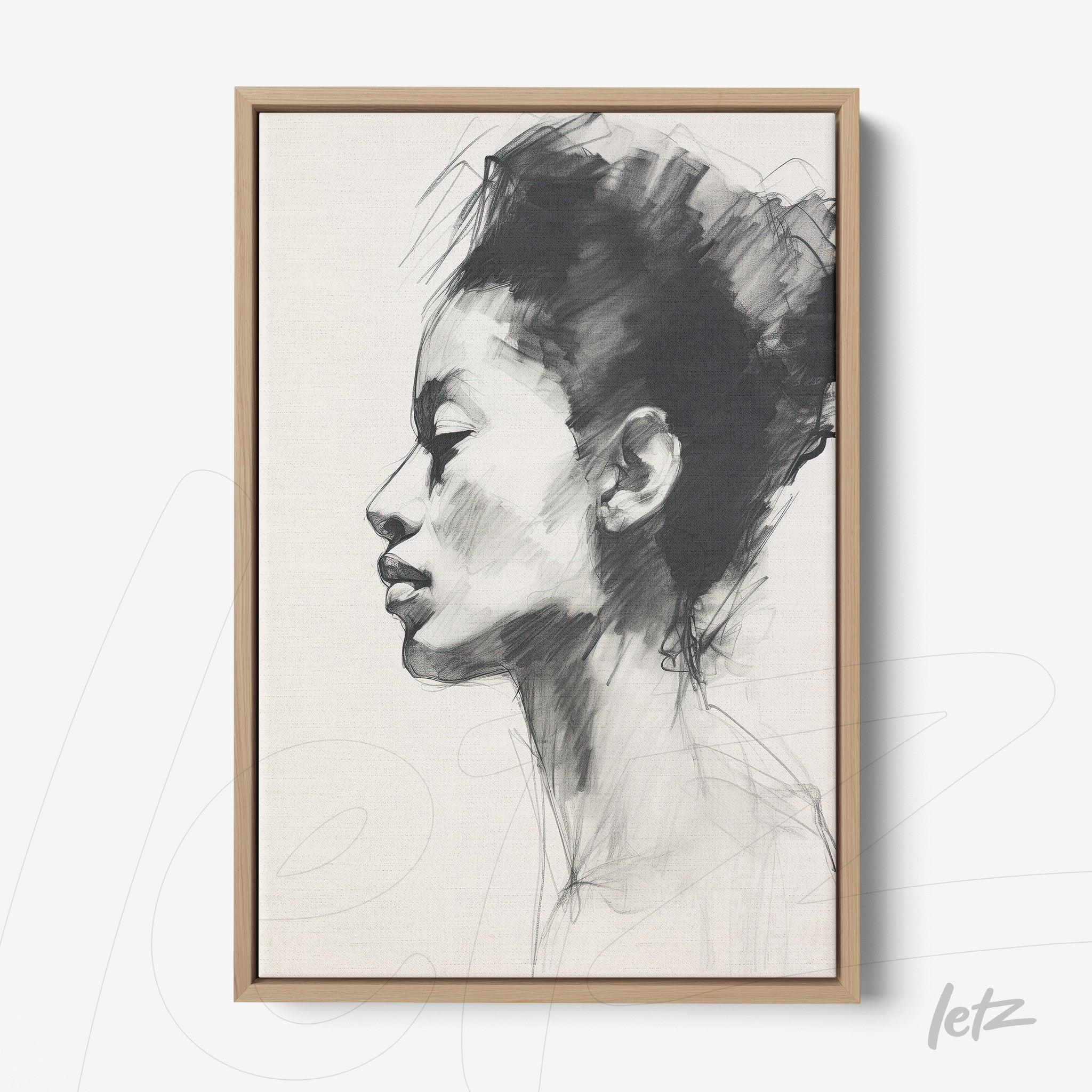 canvas art featuring a side profile portrait of a black woman in a light wood frame