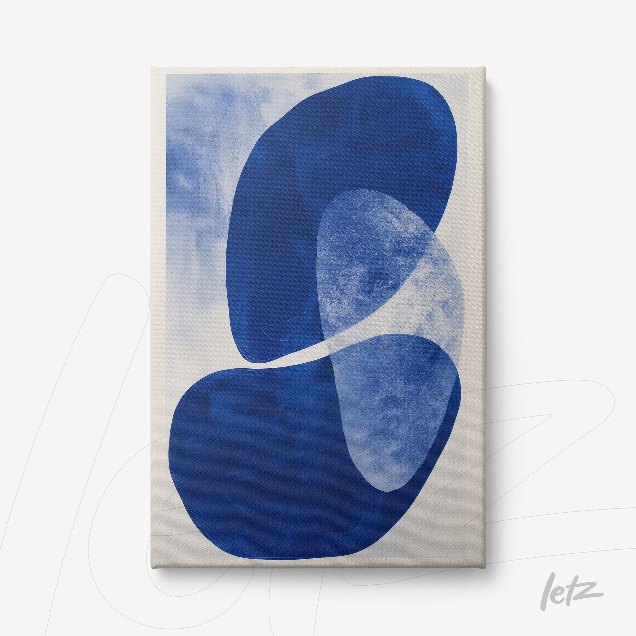 canvas art featuring abstract shapes in various shades of blue on light background