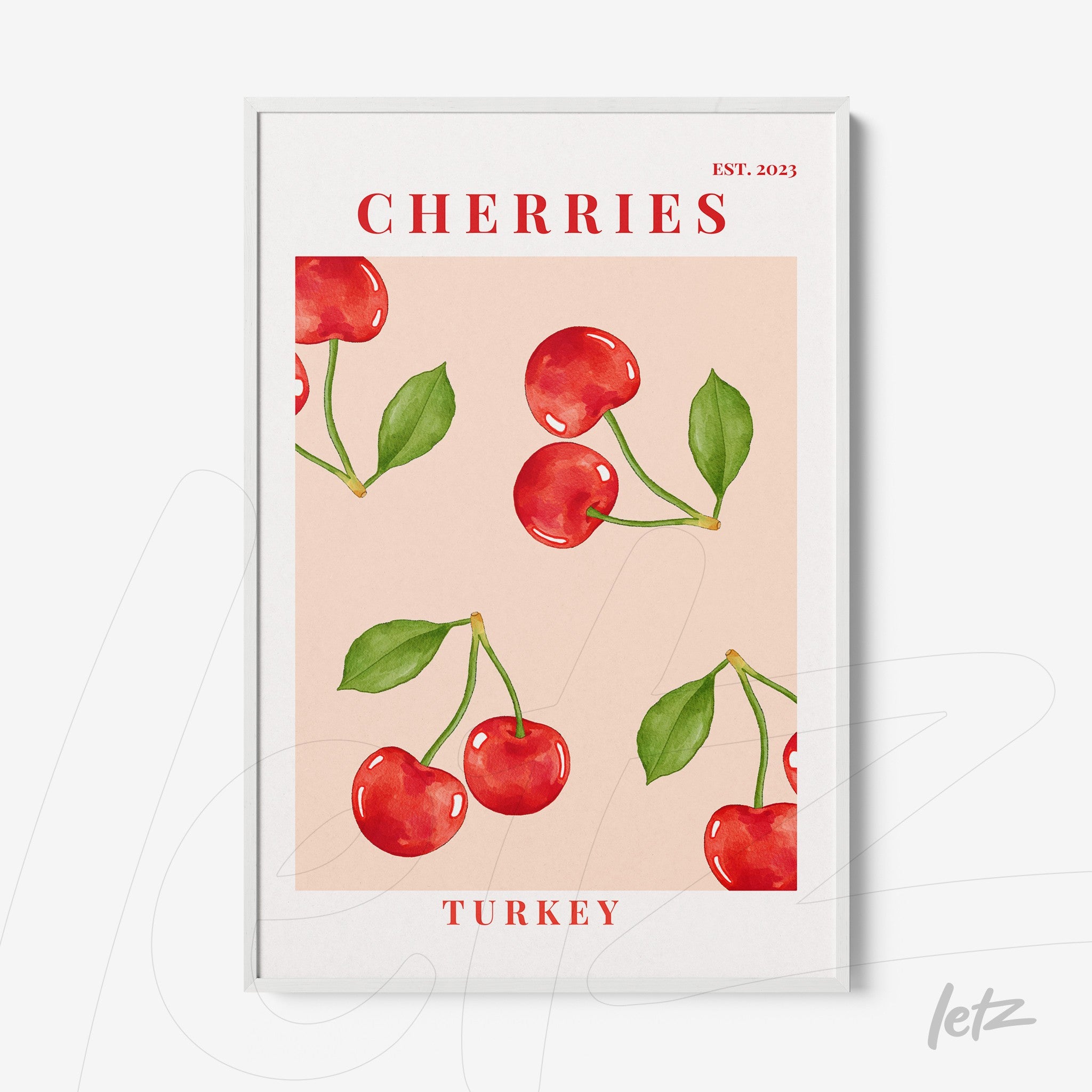 framed artwork featuring vibrant cherries on a pink background with a white frame