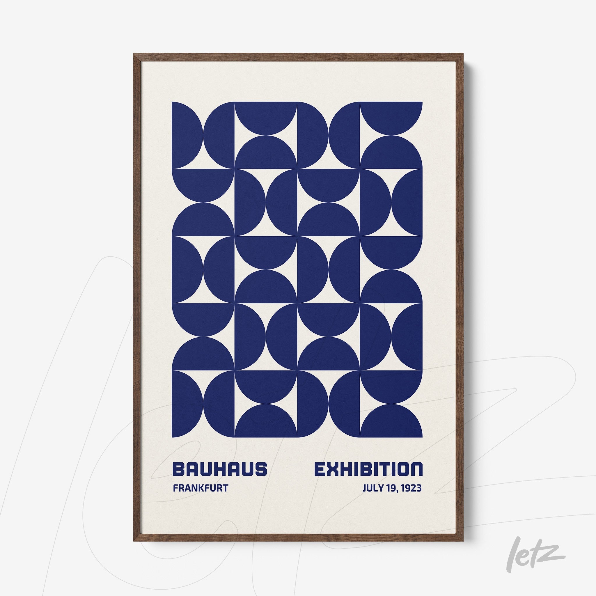 framed abstract geometric art in blue with dark wood frame