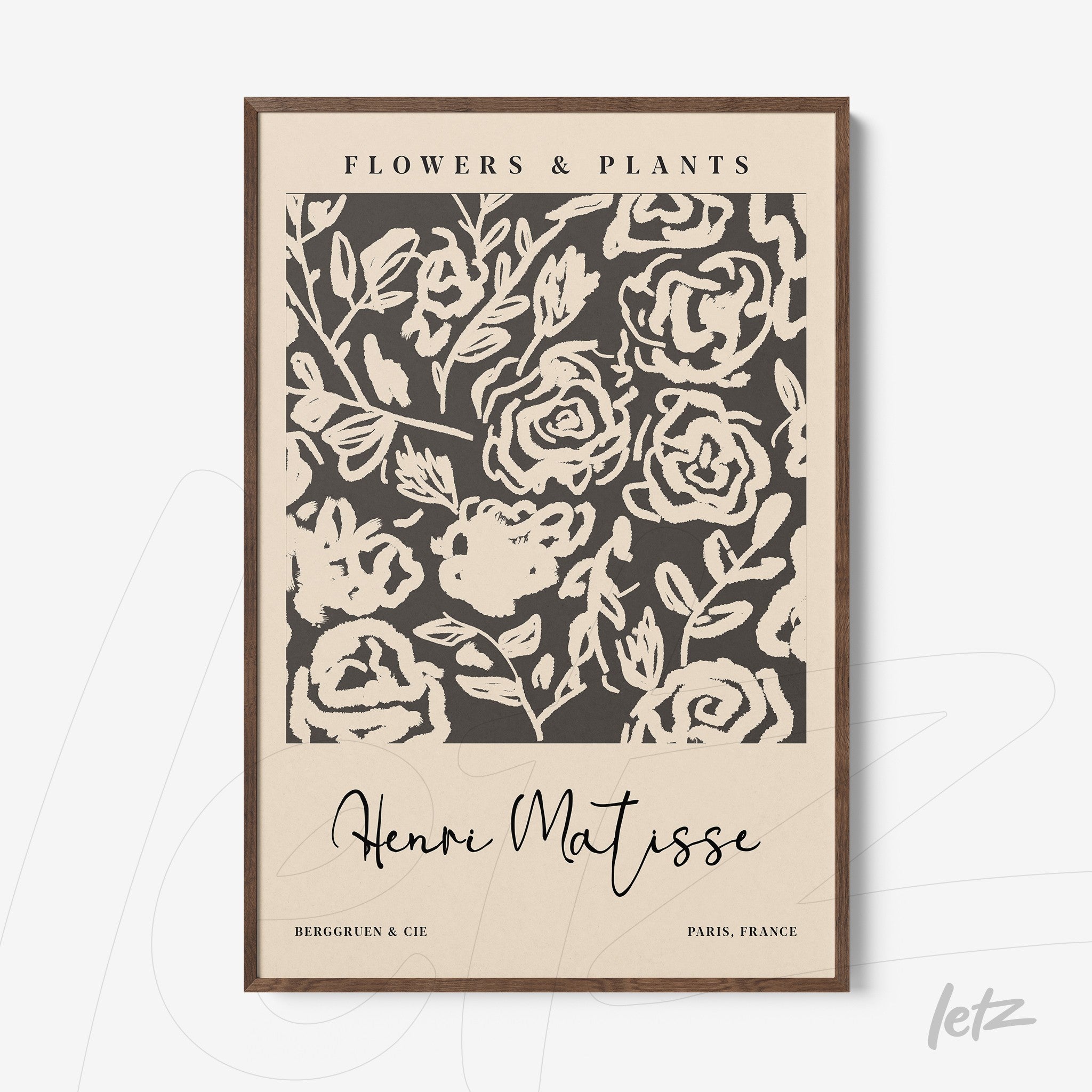 framed artwork featuring stylized floral patterns on black background with light wood frame