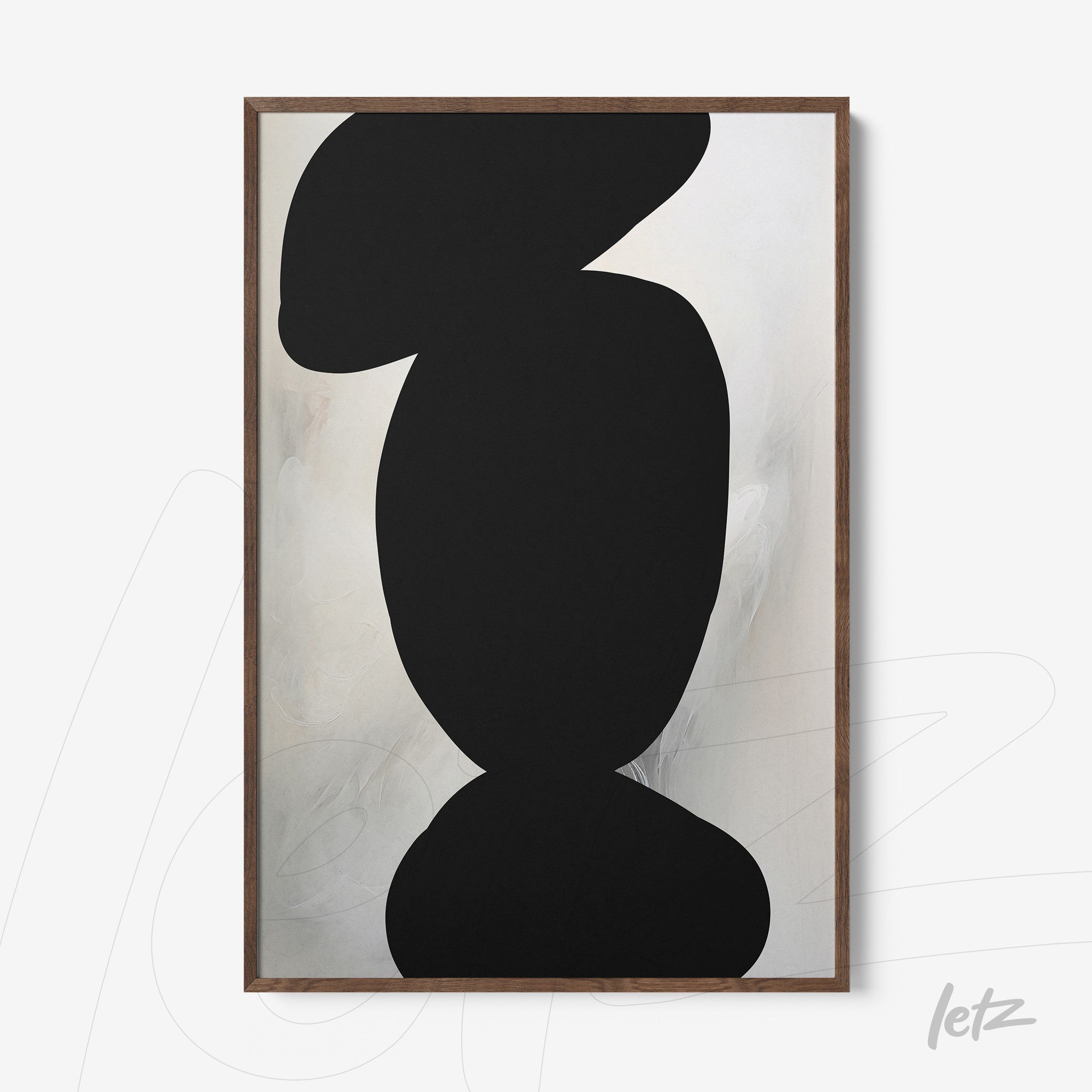 framed abstract art piece featuring black geometric shapes on a light background with dark wood frame