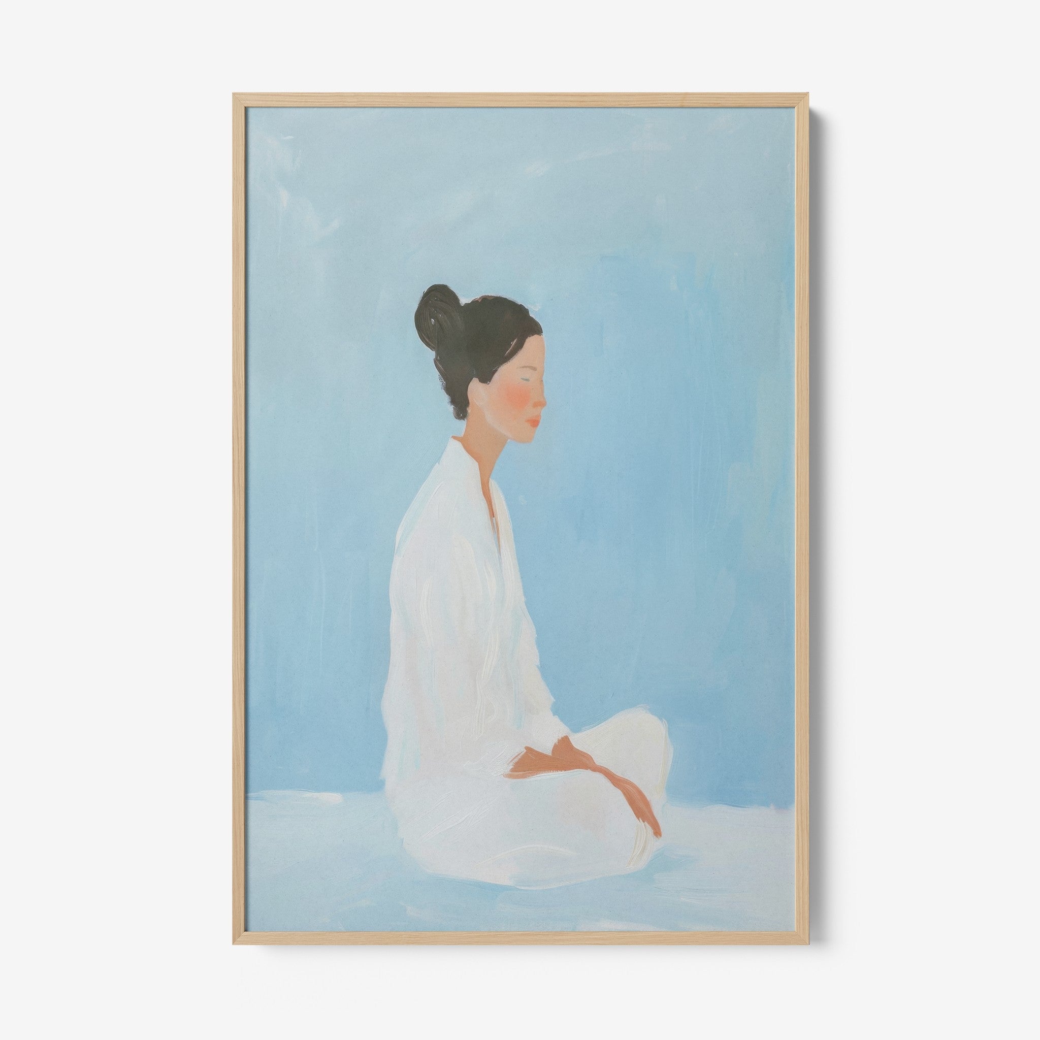 framed artwork of a seated woman against a soft blue background with light wood frame