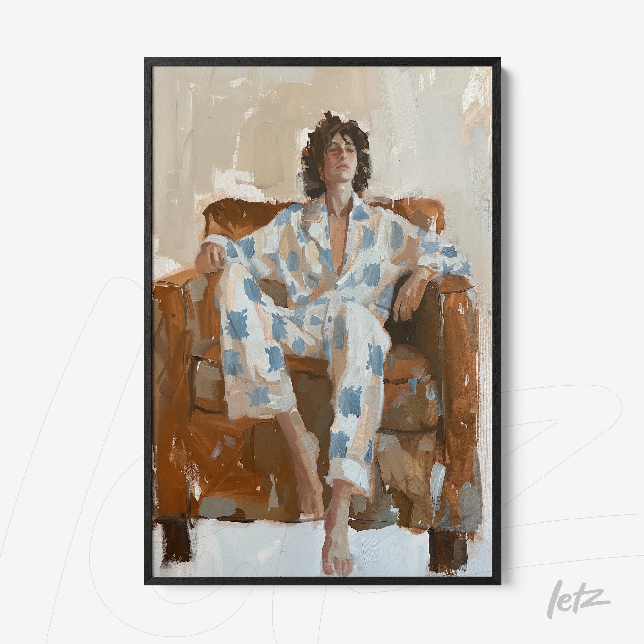framed wall art depicting a man sitting on a couch, wearing blue and white pajamas