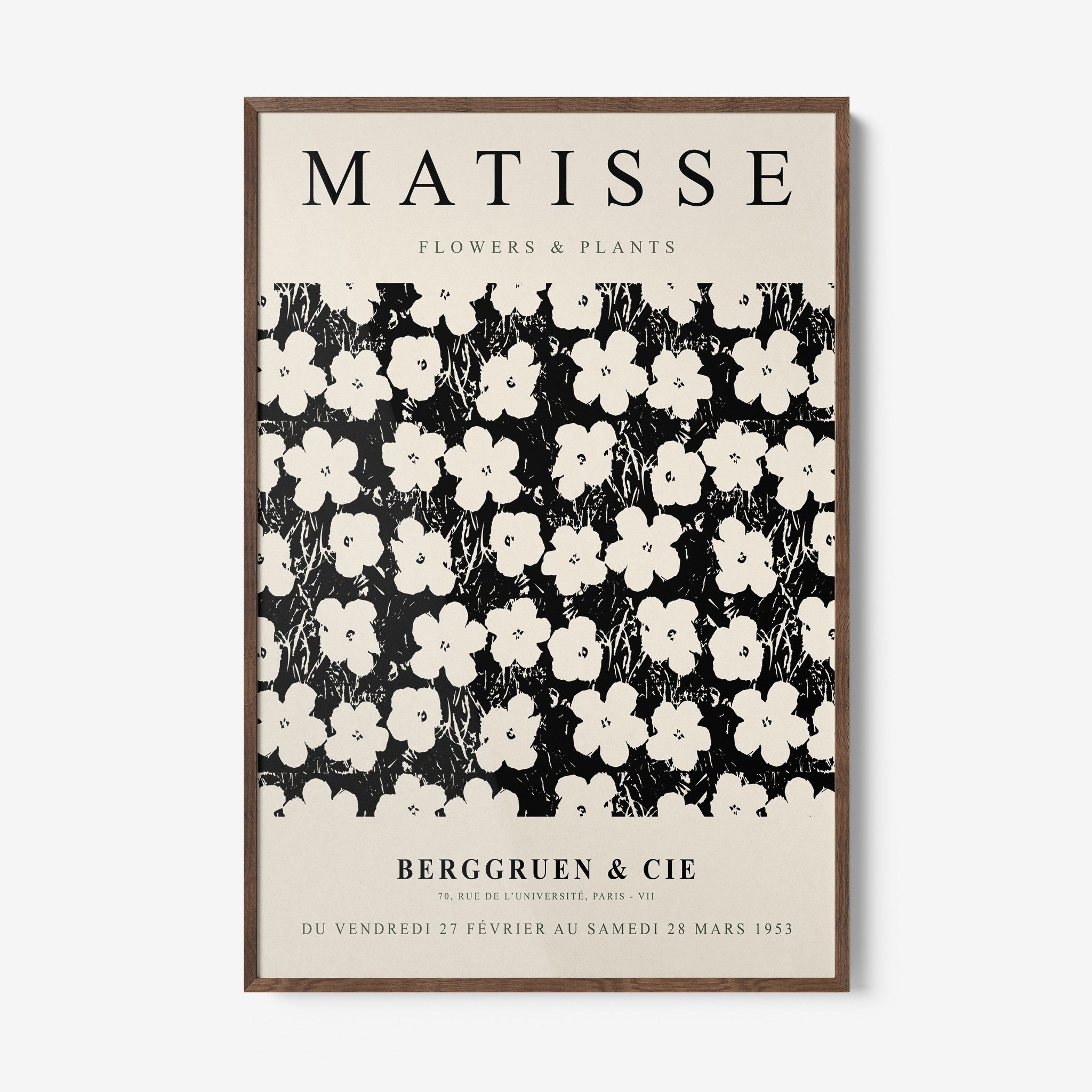 framed wall art featuring floral design in black and white with dark wood frame and light background