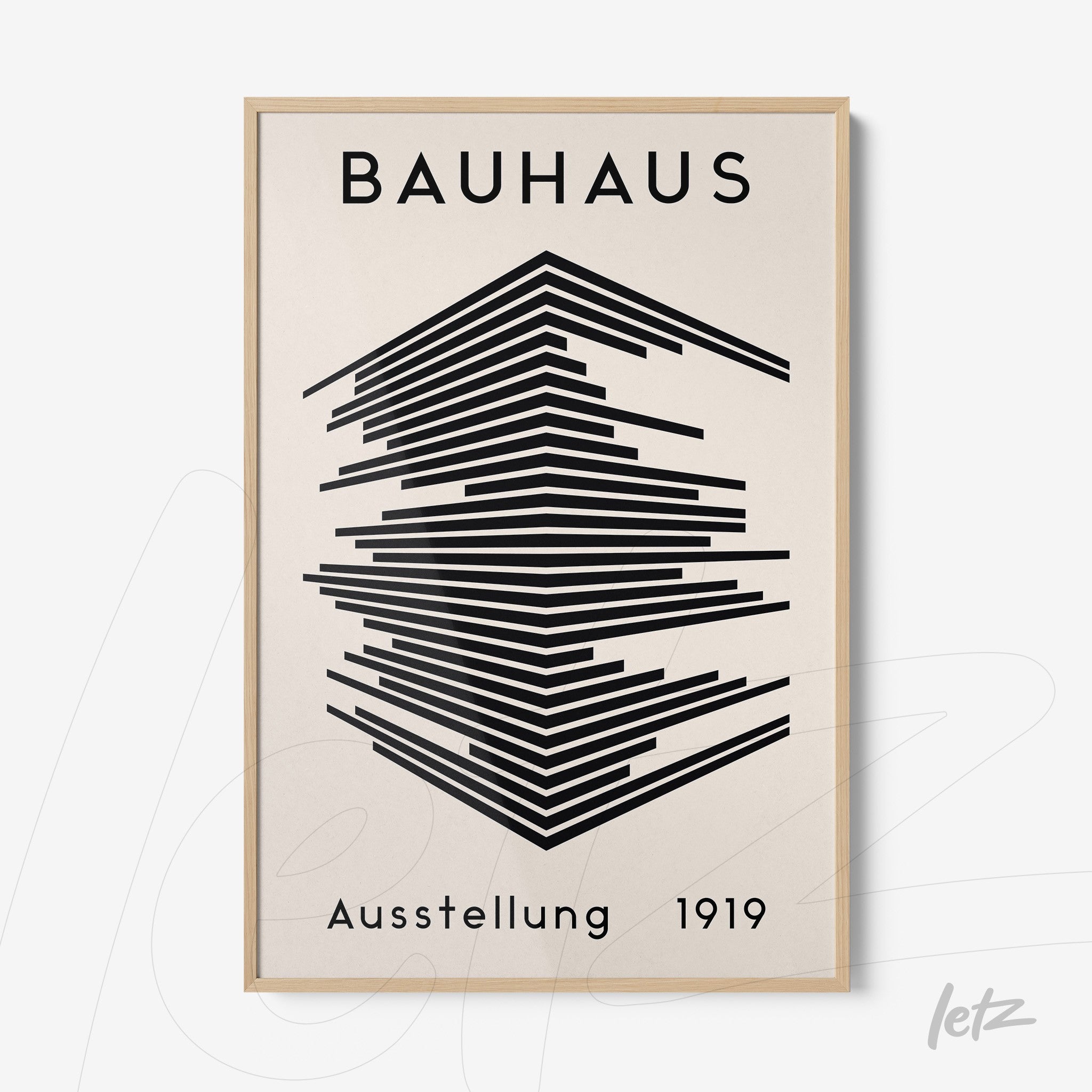 poster print with black geometric design on a cream background in a light wood frame