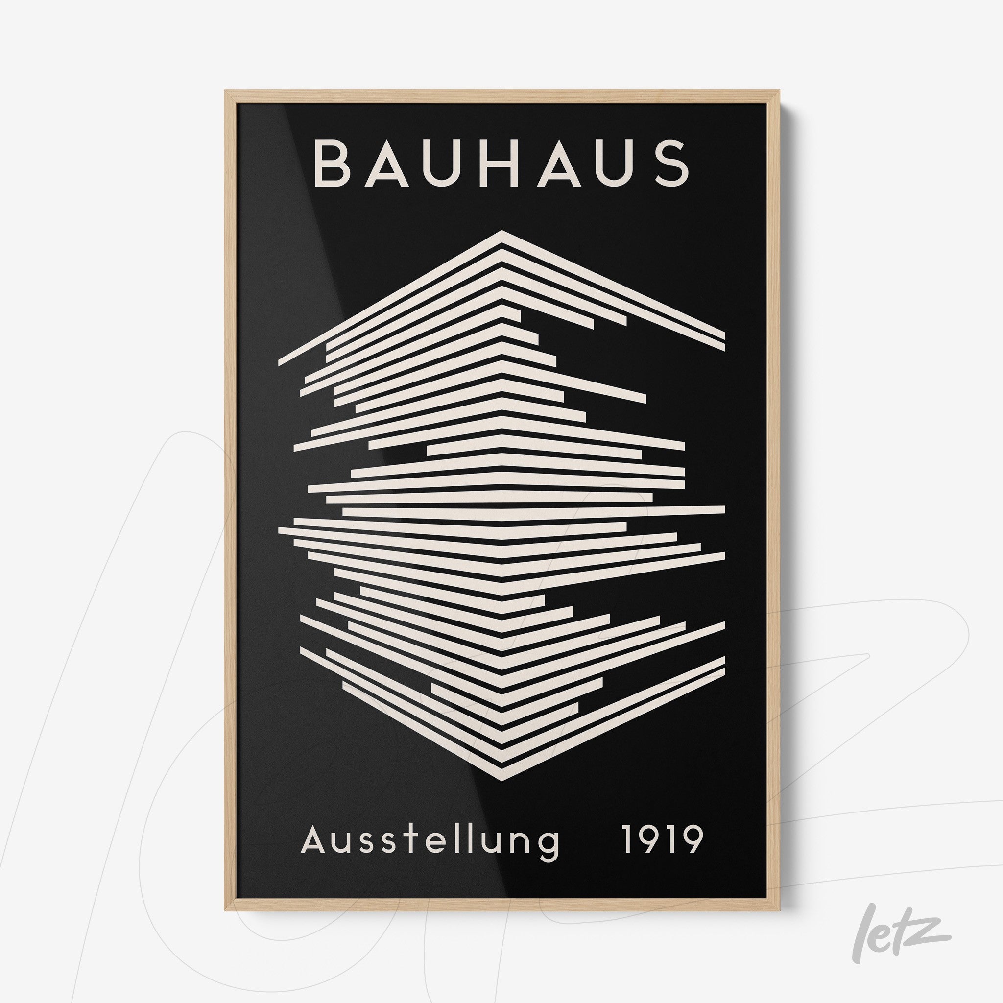 poster print in bauhaus style featuring abstract geometric design in black and white with light wood frame