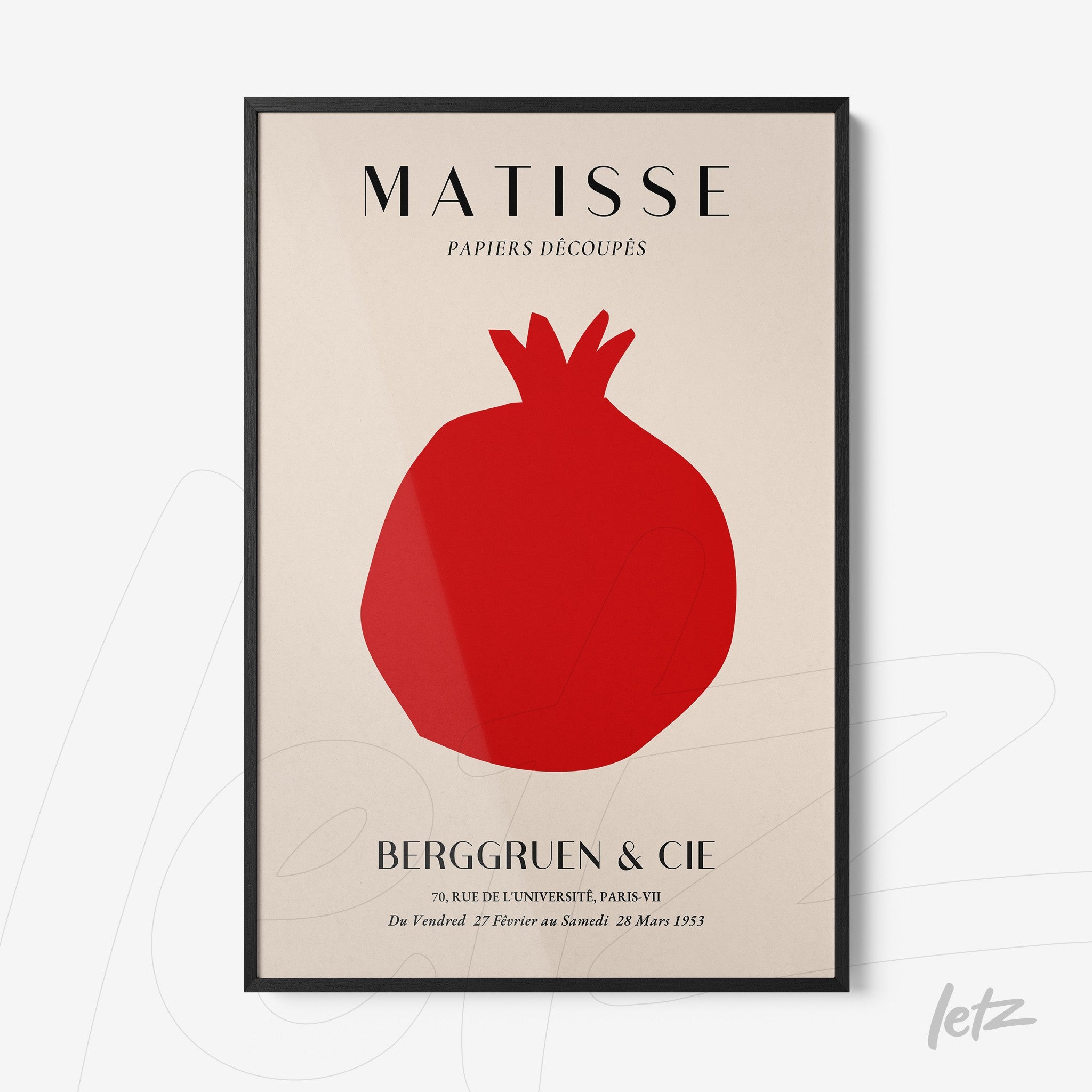 framed artwork by henri matisse featuring a red pomegranate on a neutral background with black frame