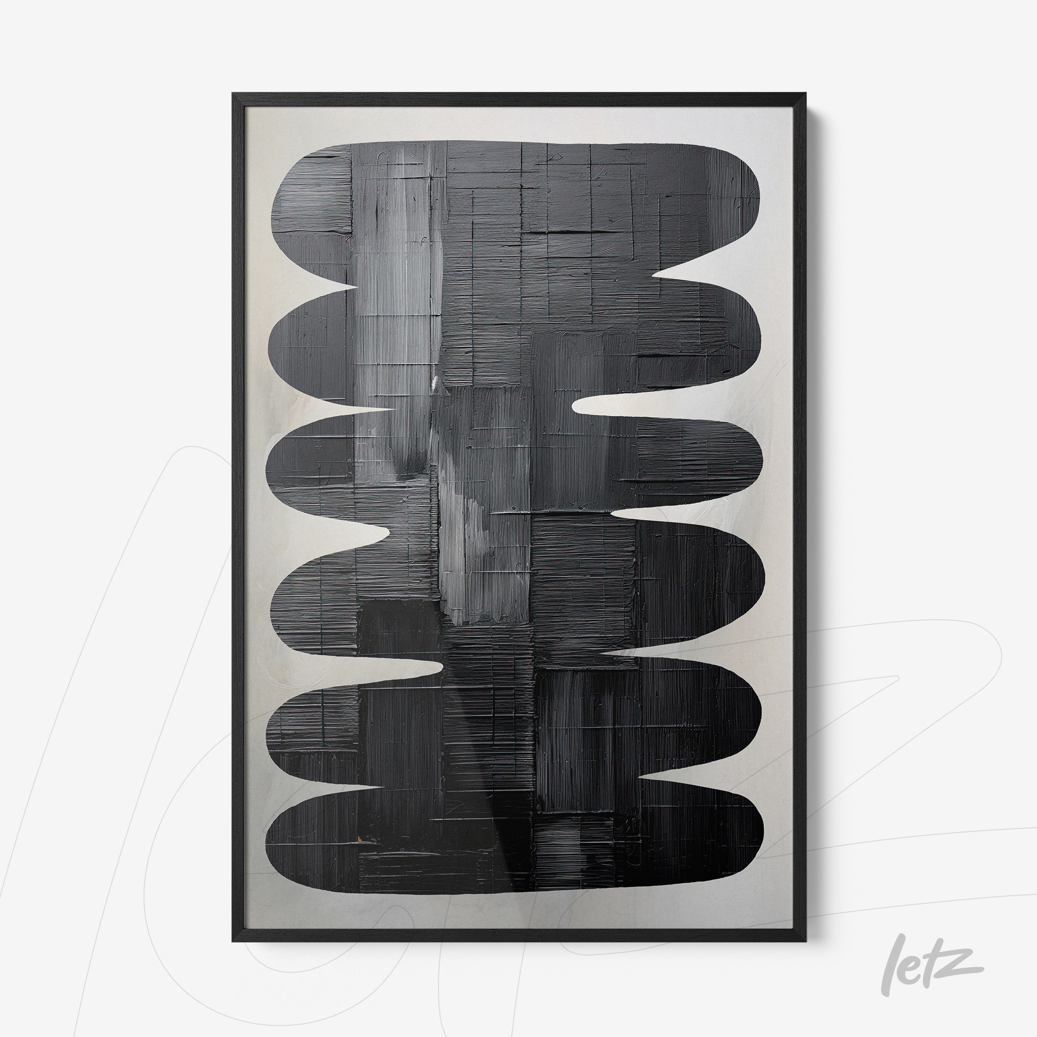 abstract wall art in black tones featuring oval shapes on a light background with black frame