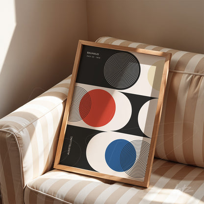 modernist framed art of colorful circles on a striped sofa with wooden frame