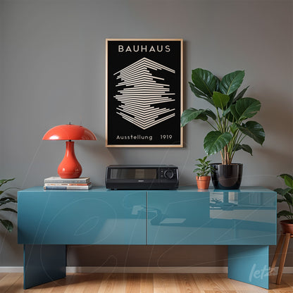 framed geometric bauhaus style illustration from 1919 with a light wood frame on a gray wall