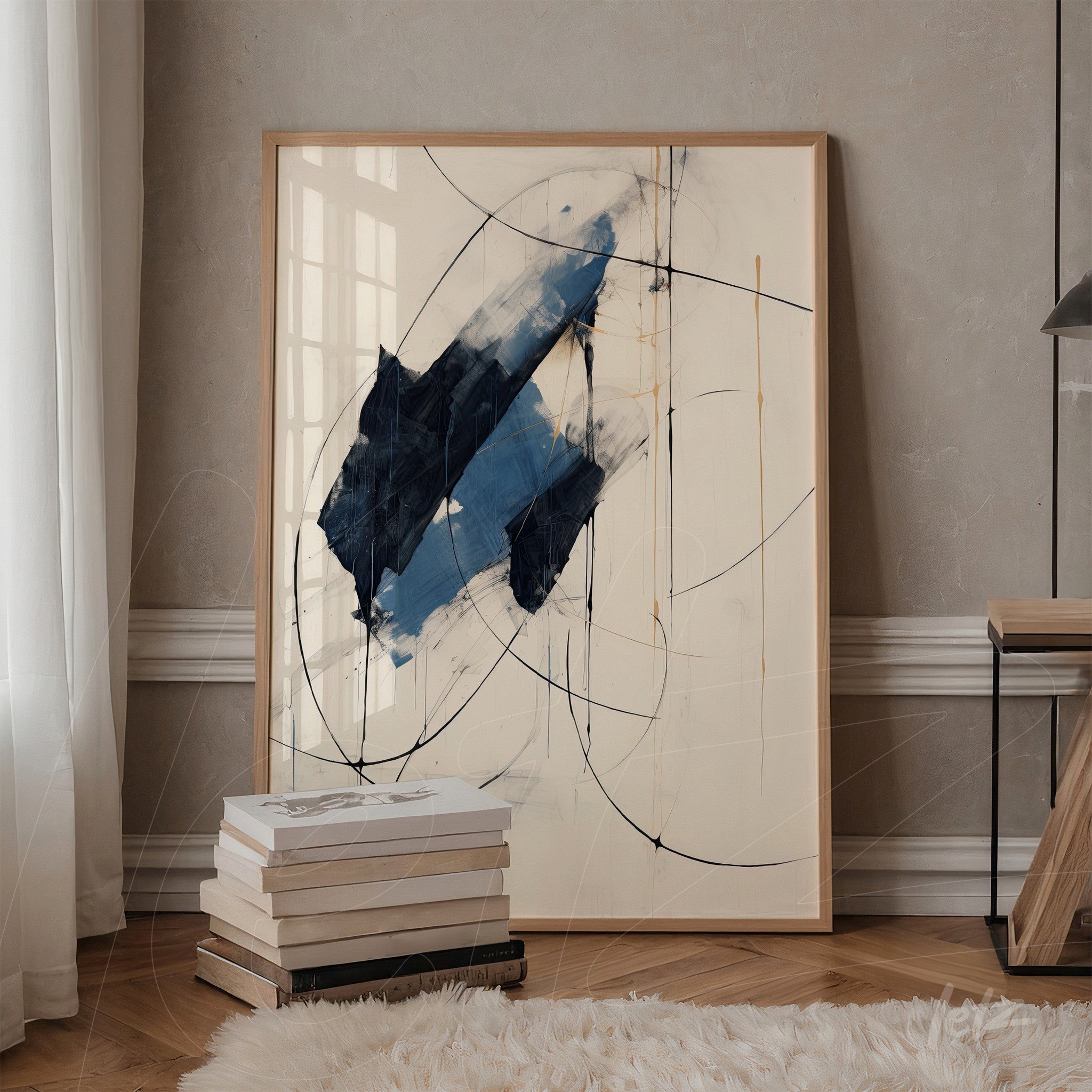 abstract painting featuring large navy blue shapes with black details, framed in light wood, leaning against a textured beige wall