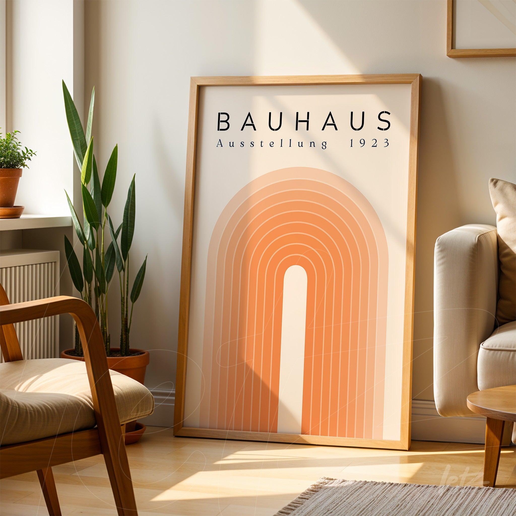 poster print with geometric design in orange tones and light wooden frame resting in a modern living room