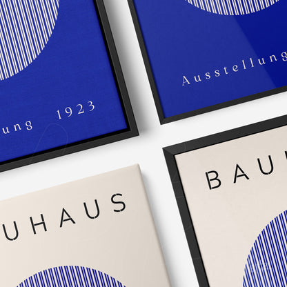 canvas print featuring modernist graphic design with text in blue and beige displayed in black frame