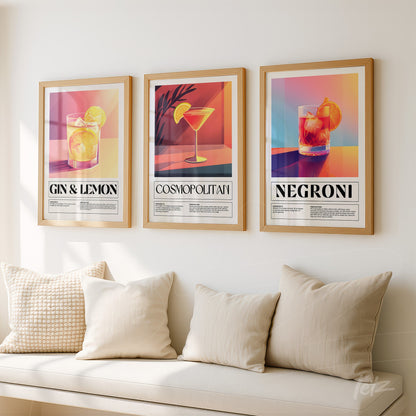 set of three framed artworks featuring colorful cocktails with large titles and vibrant backgrounds